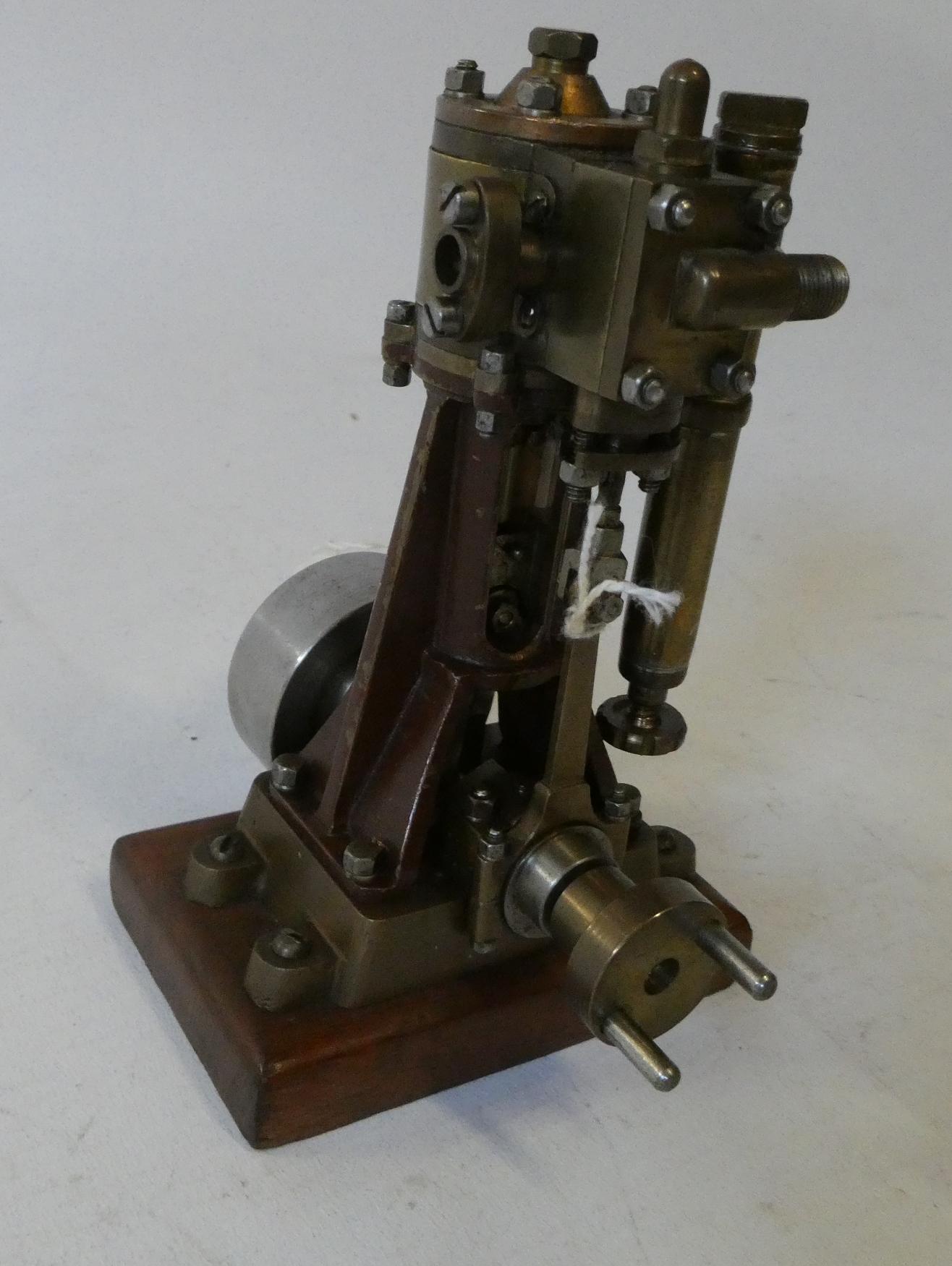 A single cylinder non reversing steam engine with maker's plate Moss of London, a very well-made Image