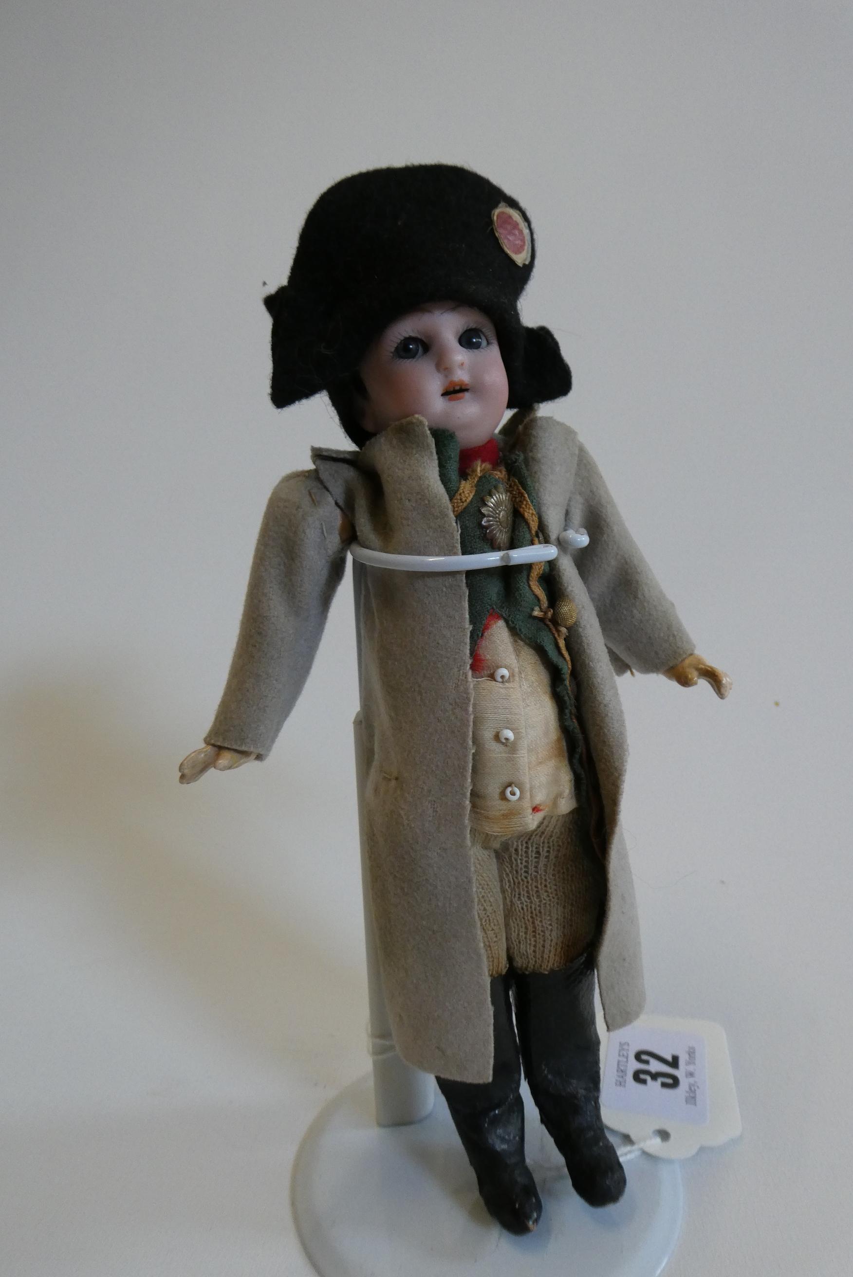 A bisque head Napoleon doll Image