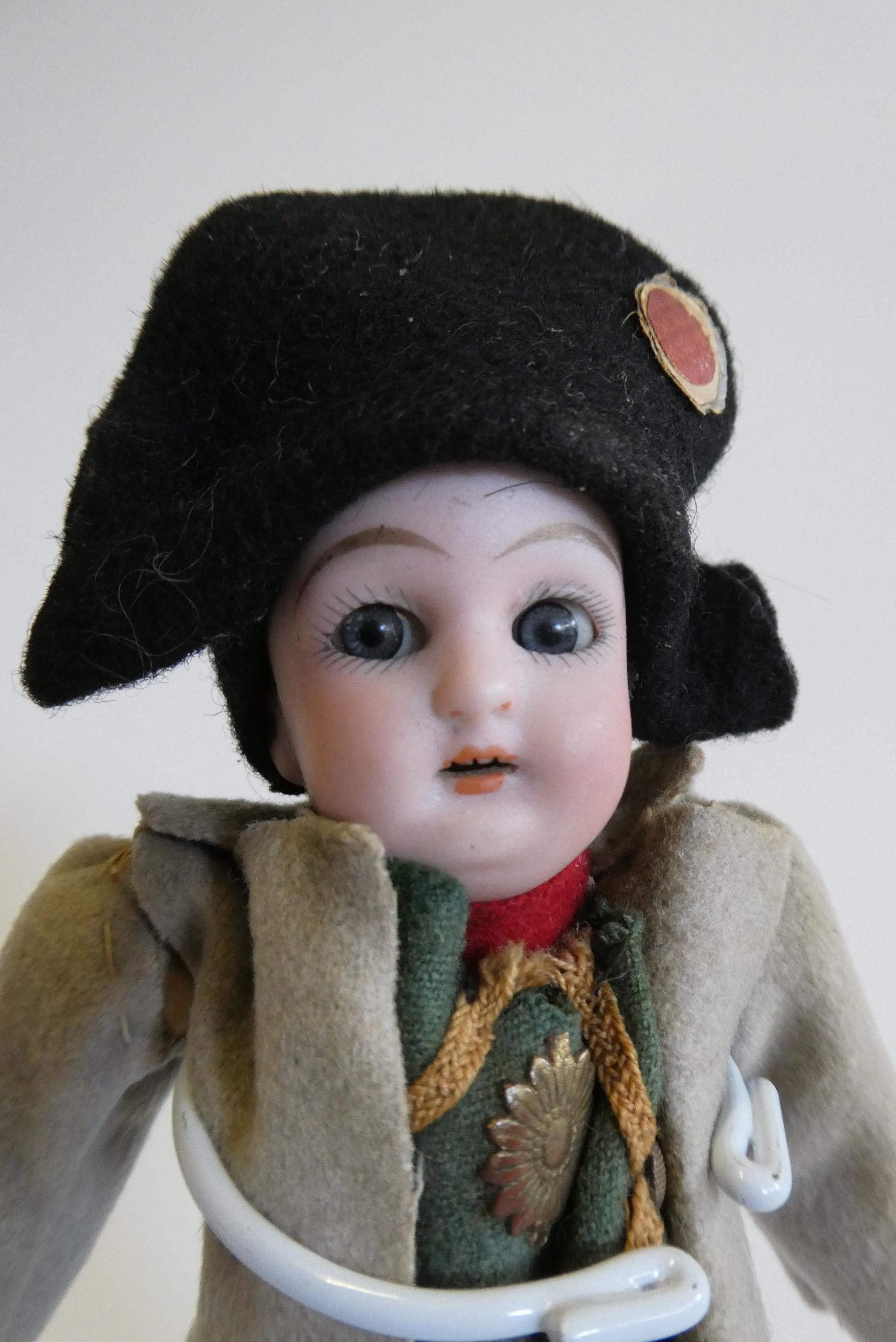 A bisque head Napoleon doll Image
