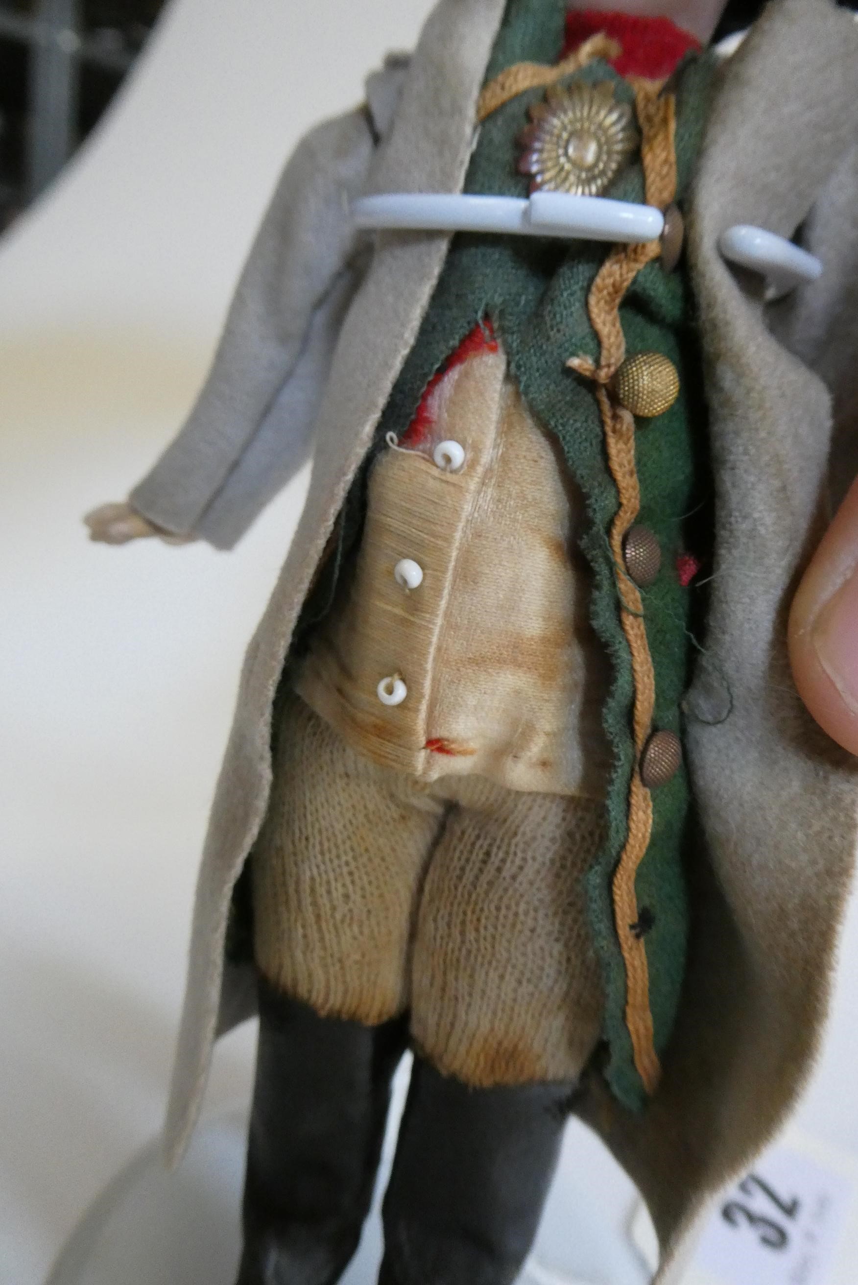 A bisque head Napoleon doll Image