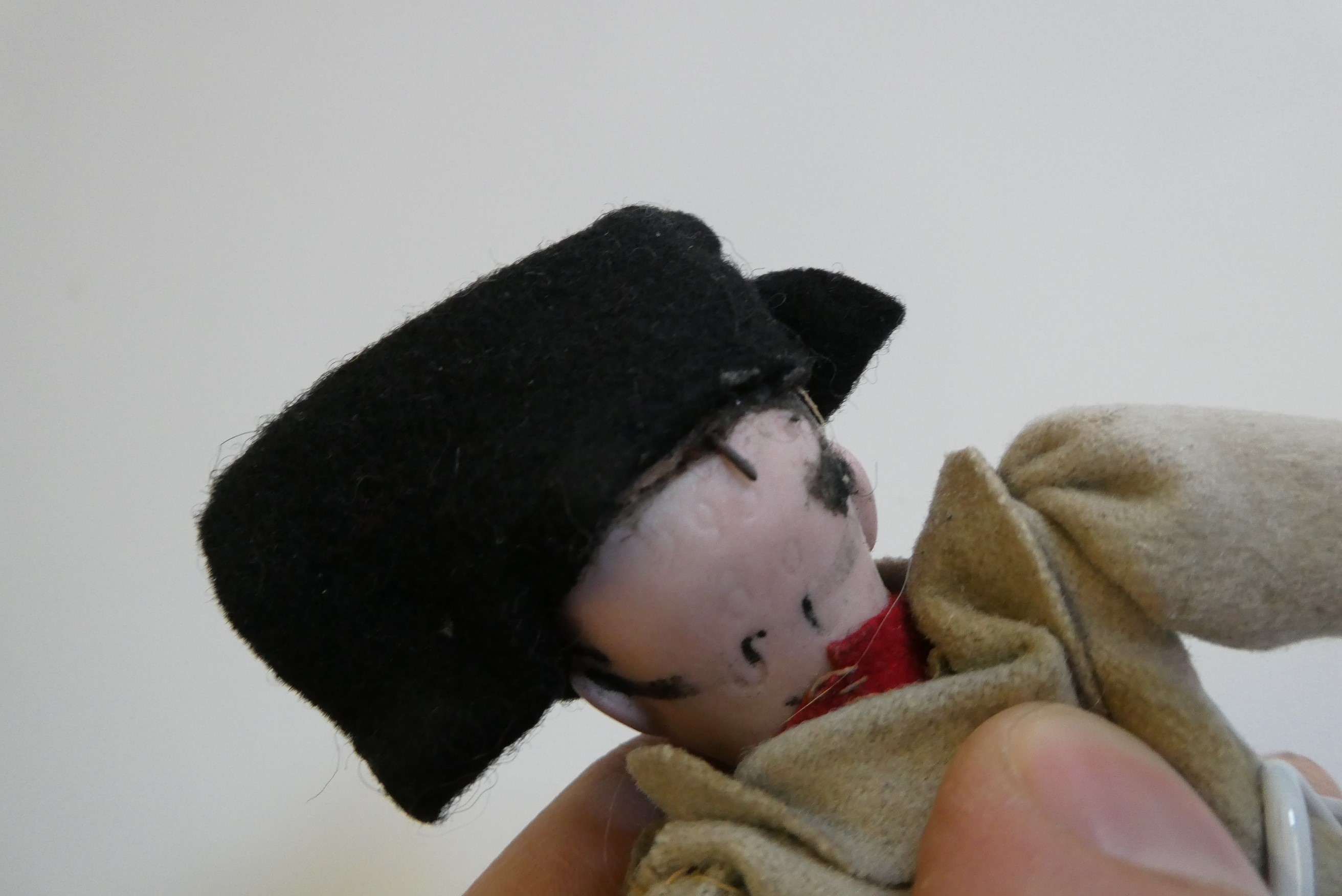 A bisque head Napoleon doll Image