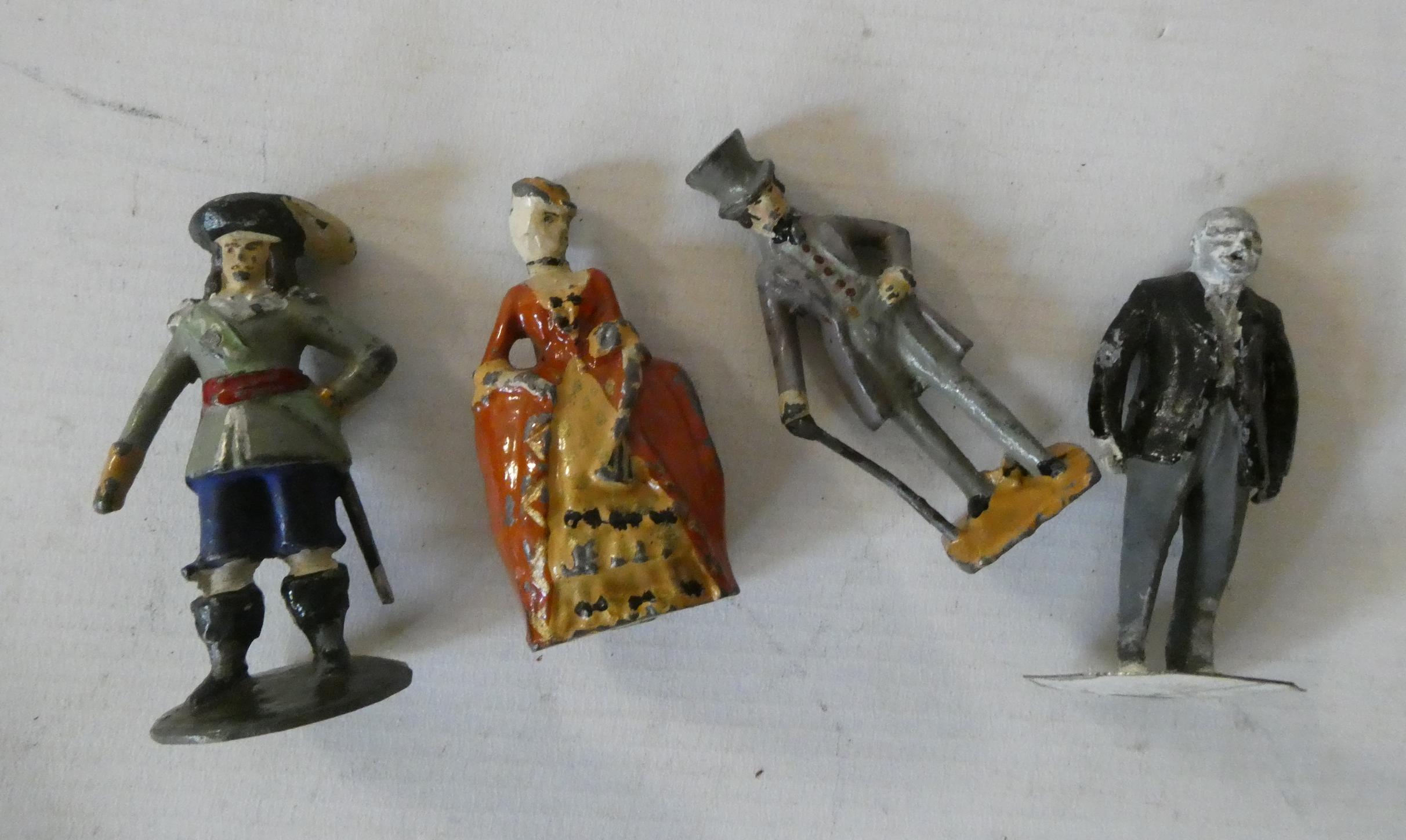 Four solid lead cast hand painted character figures of unknown origin including Churchill figure, Image