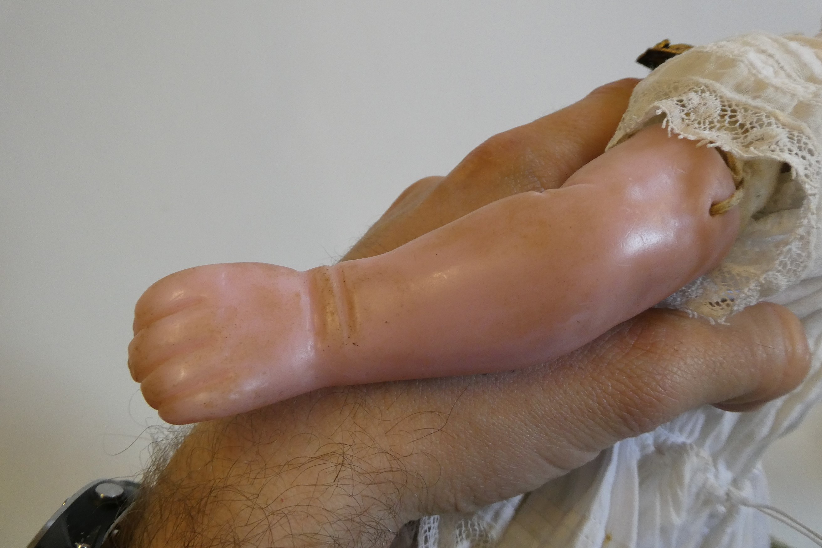 A Victorian wax shoulder head doll, with blue glass paperweight eyes, closed mouth, inserted blond Image