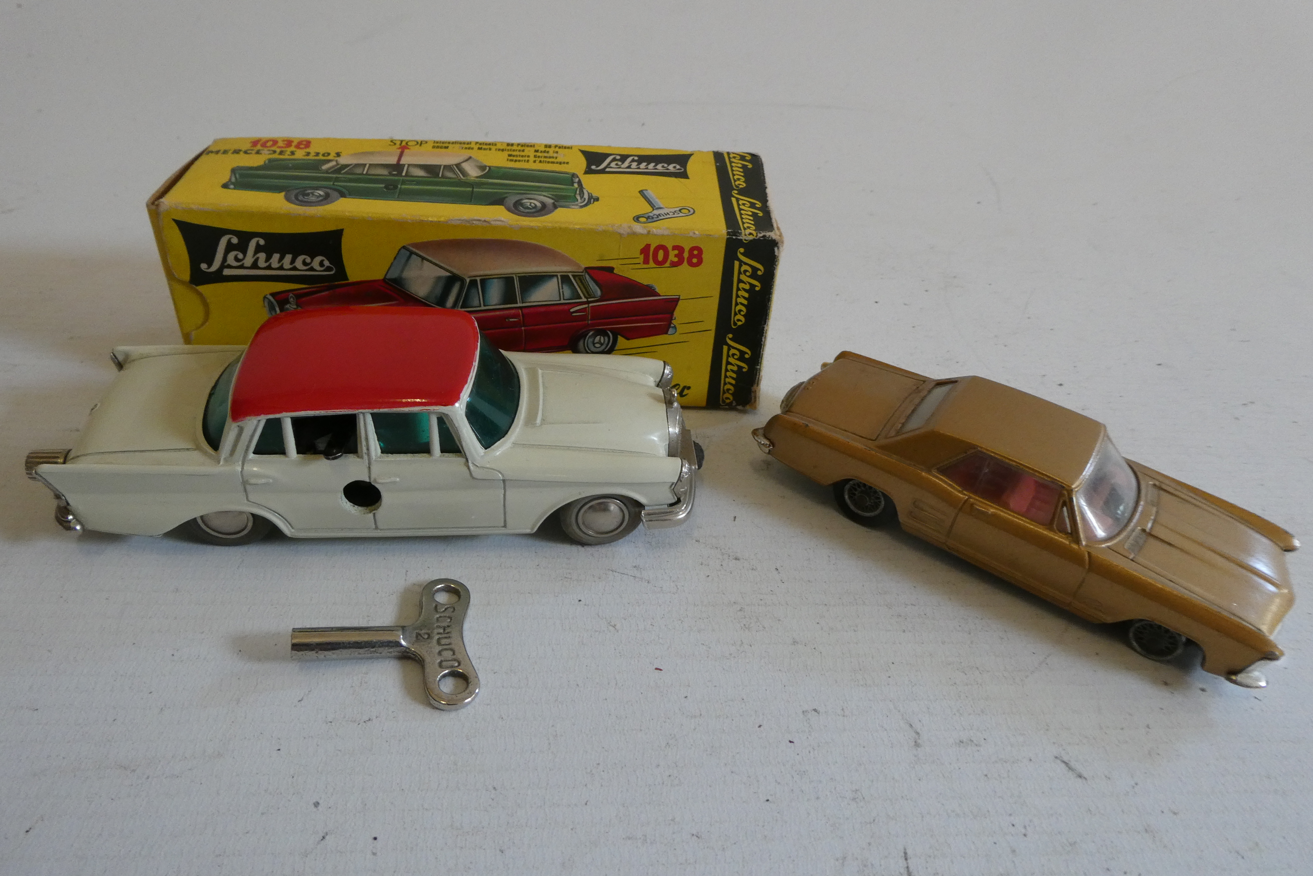 Schuco 1038 Mercedes clockwork Micro Racer, box AF, model excellent, and a Corgi Buick, two tyres Image