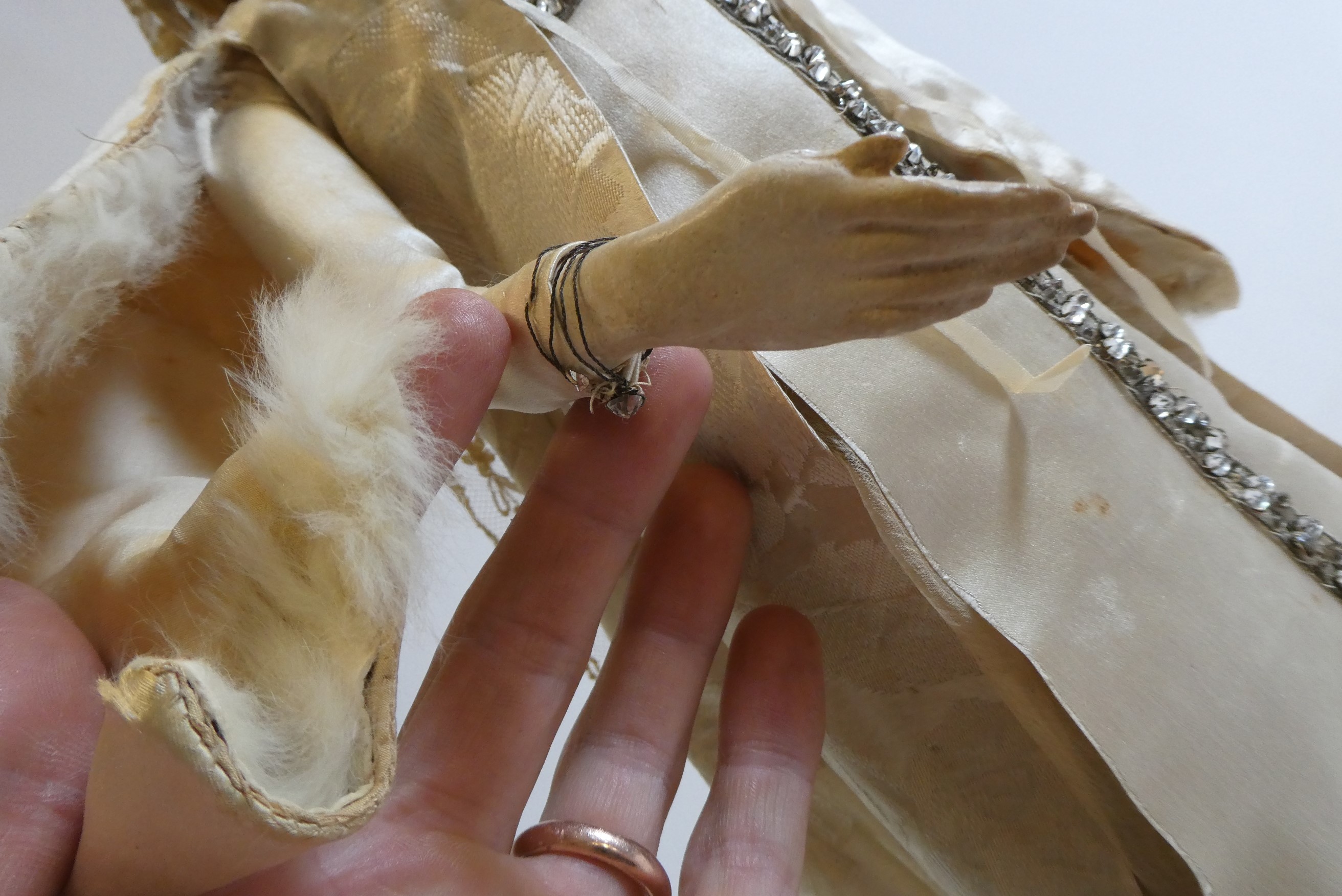 A high quality Victorian wax shoulder head doll with brown glass fixed eyes Image