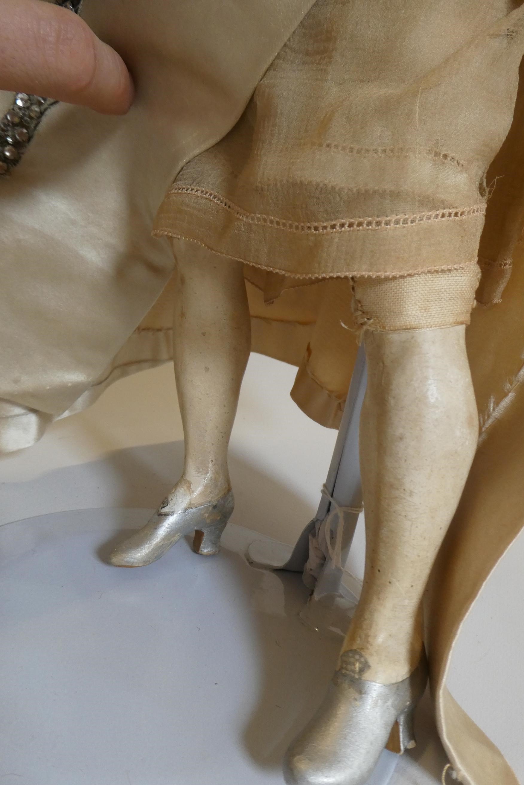 A high quality Victorian wax shoulder head doll with brown glass fixed eyes Image