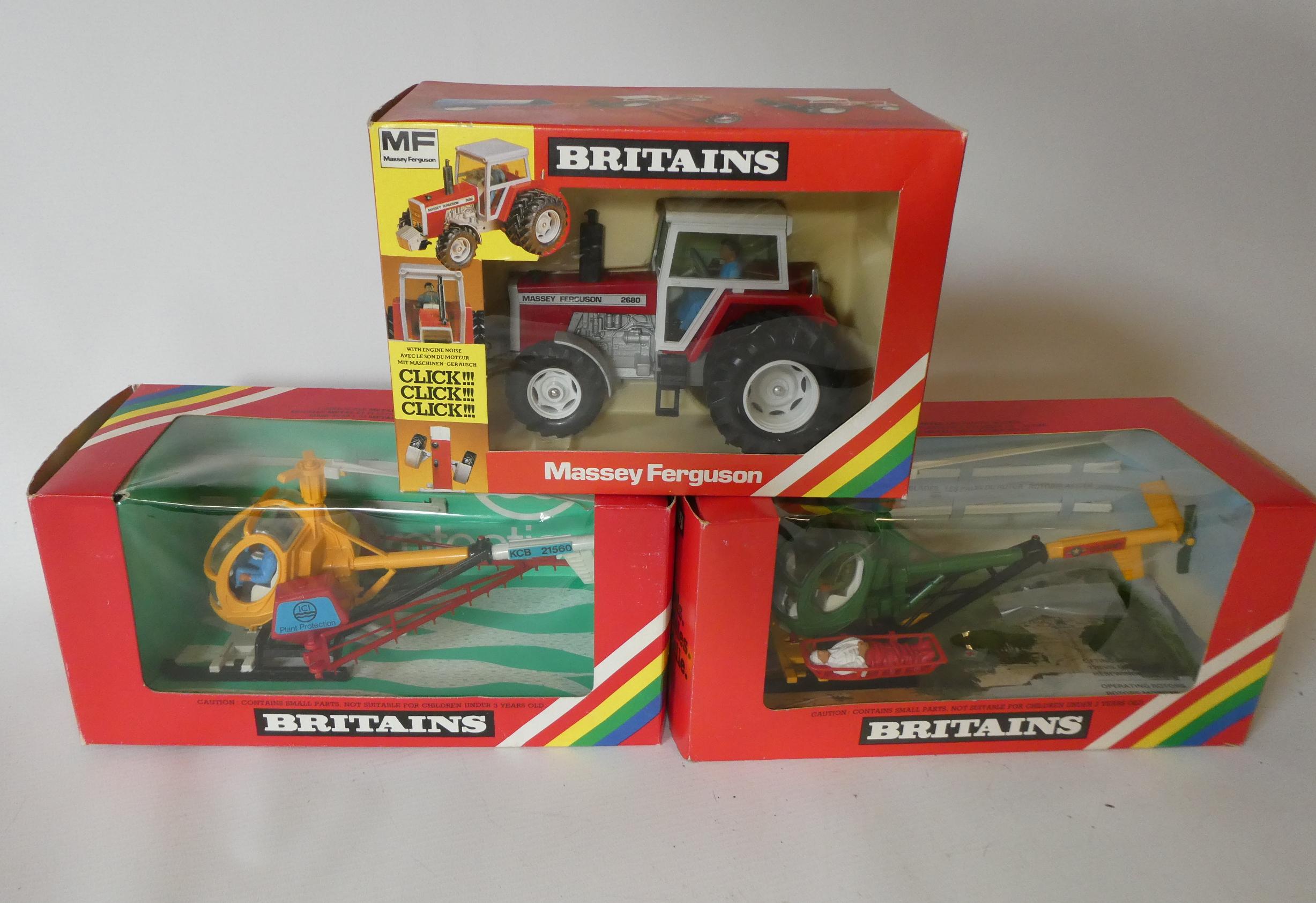 Britains 9511 helicopter crop sprayer, 9761 military helicopter and 9517 Massey Ferguson double Image
