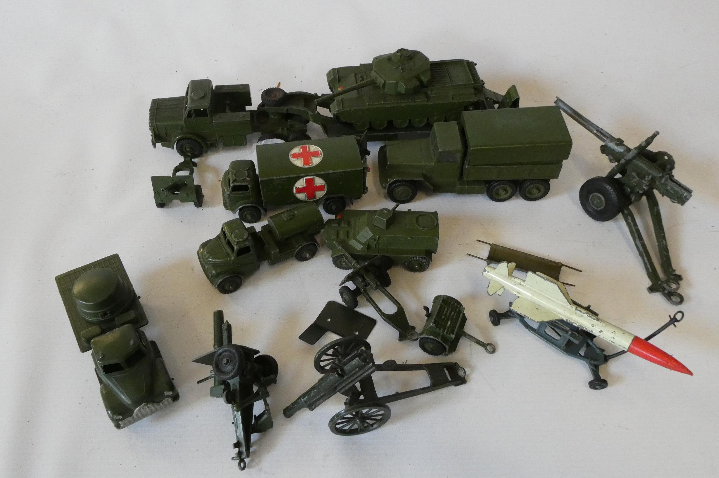 Unboxed army vehicles by Dinky, Corgi and others including tank transporters and field guns, fair Image