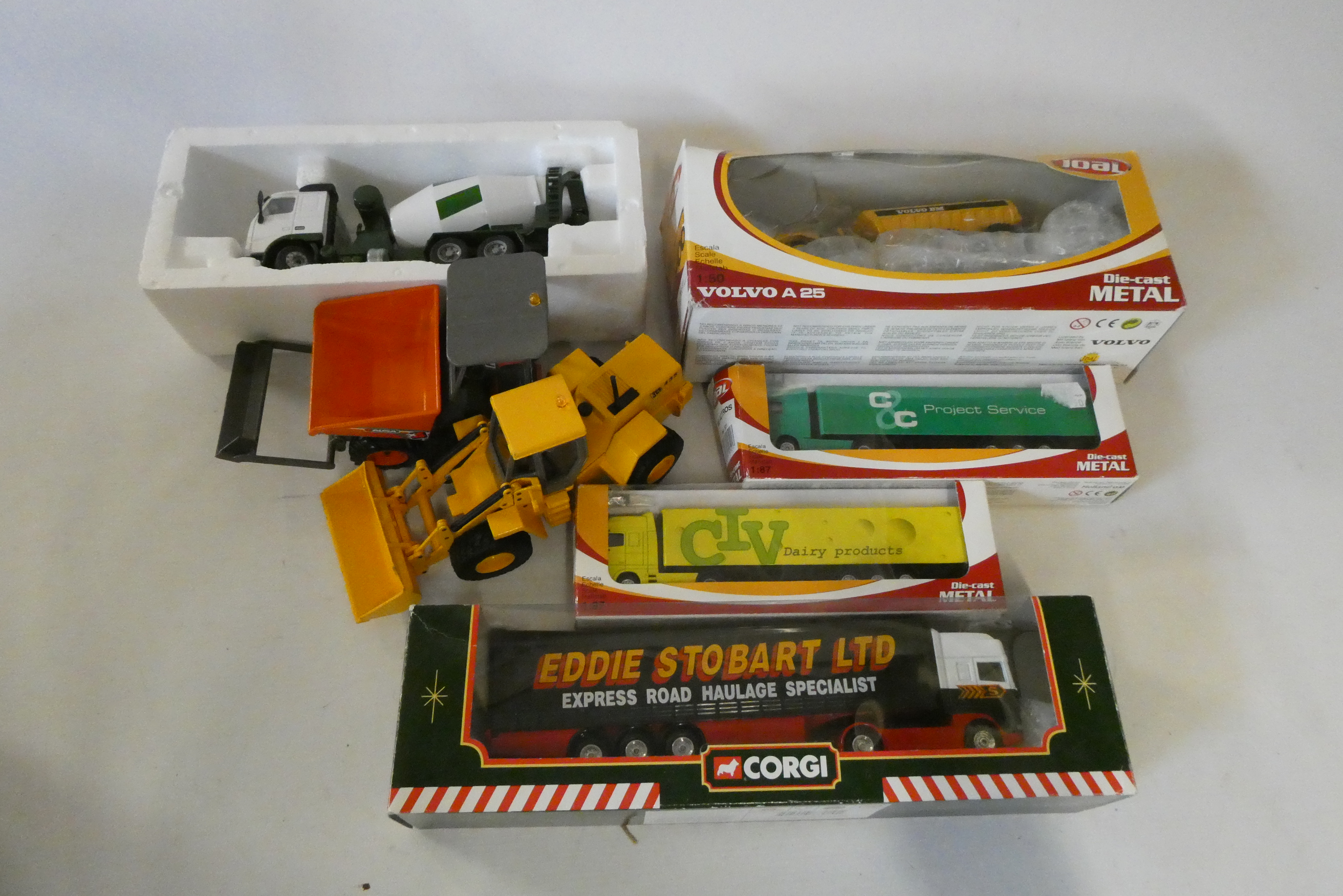 Late issue diecast vehicles including construction equipment and Stobart truck, some items boxed, Image