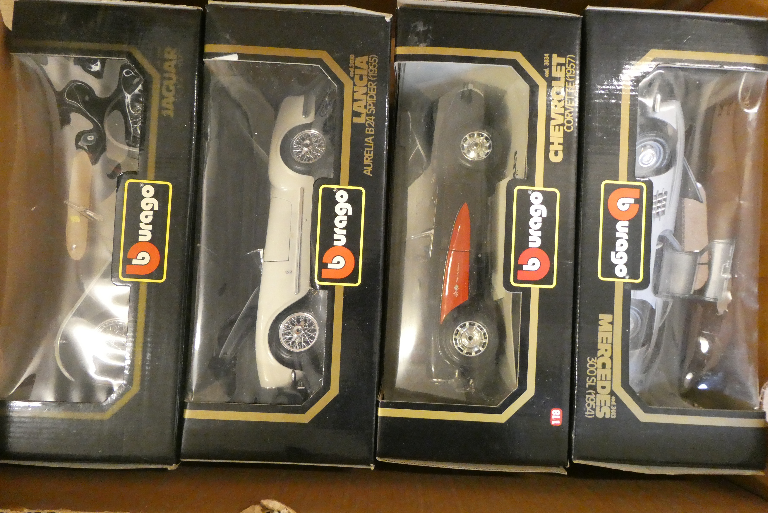 Four 1/18th scale classic cars by Burago including Mercedes, Lancia and Chevrolet, all items boxed, Image