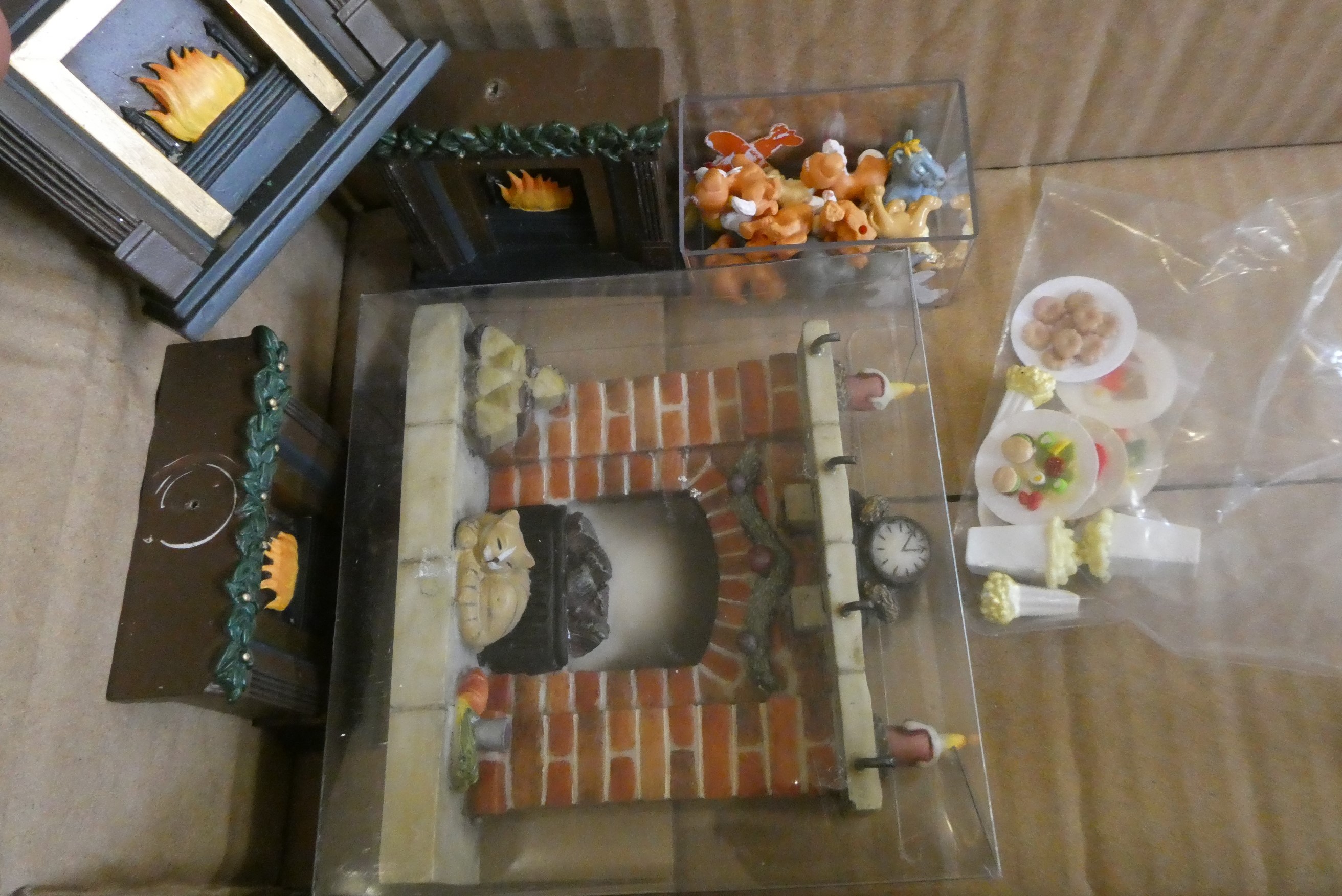 Four boxes of doll's house furniture and accessories Image