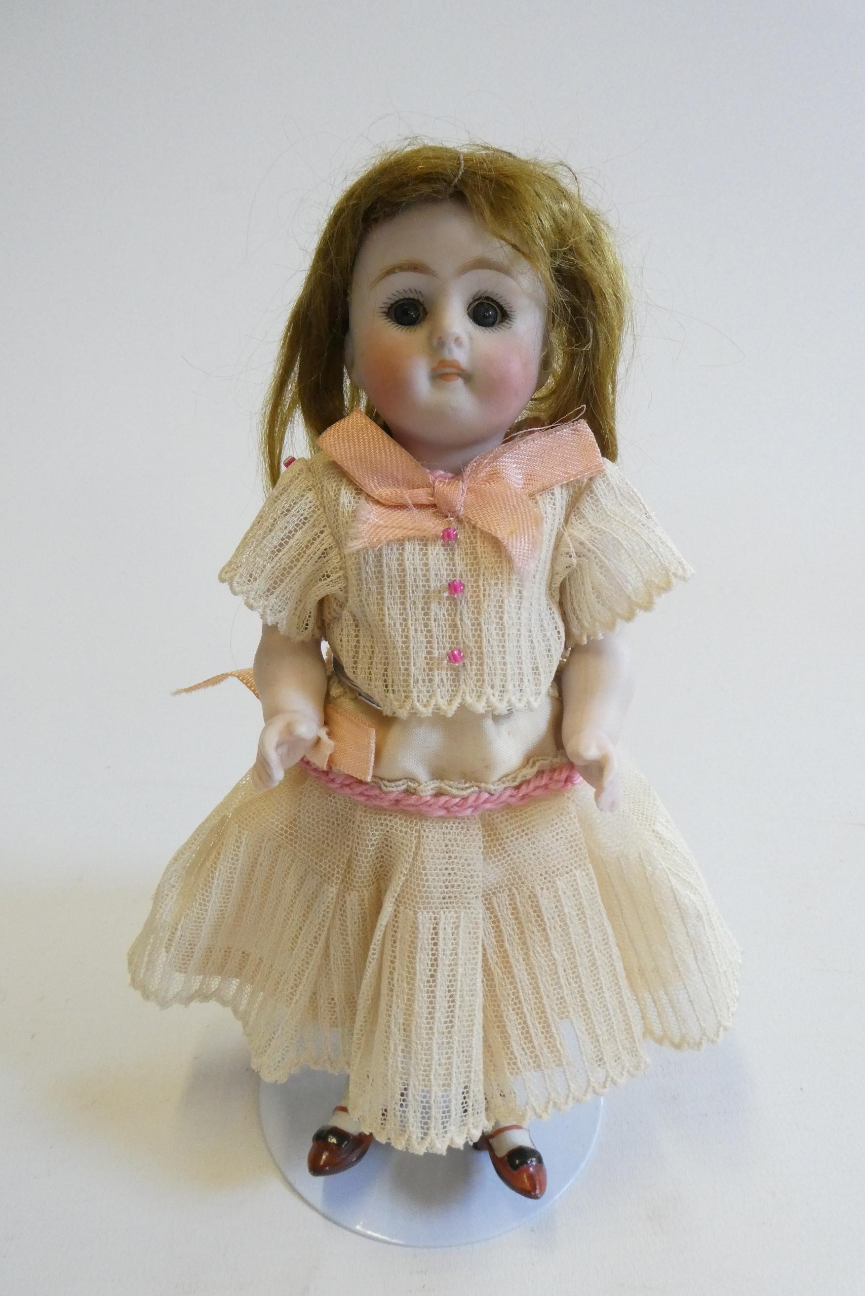 A mignonette all bisque doll Image