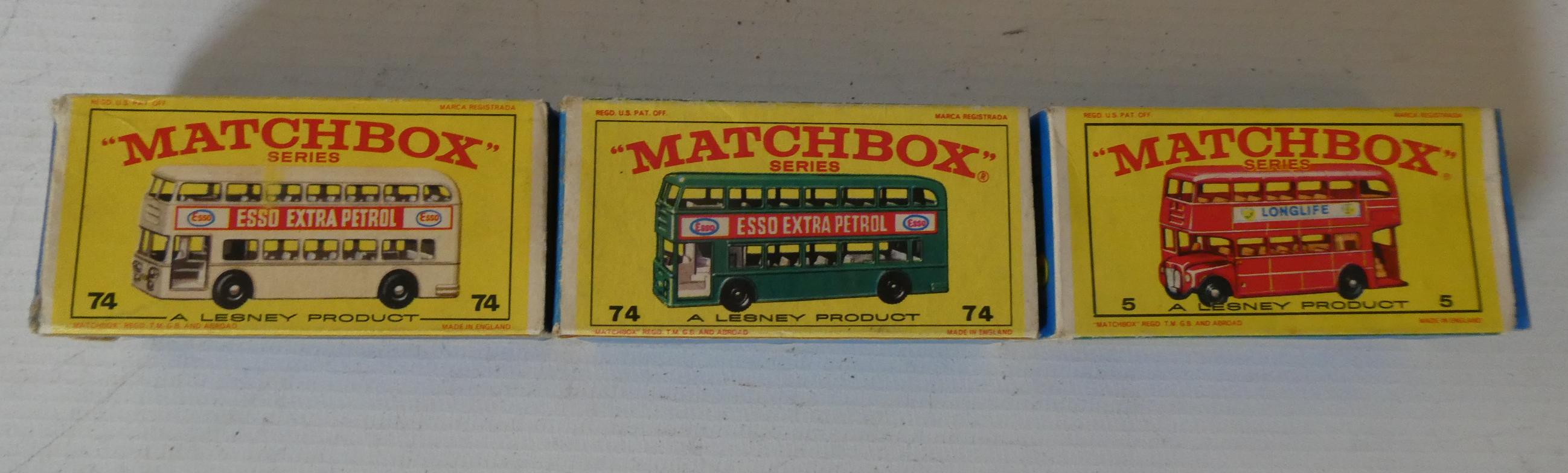 Three Matchbox bus models comprising No 74 Daimler in green, No 74 Daimler in white and No 5 London Image