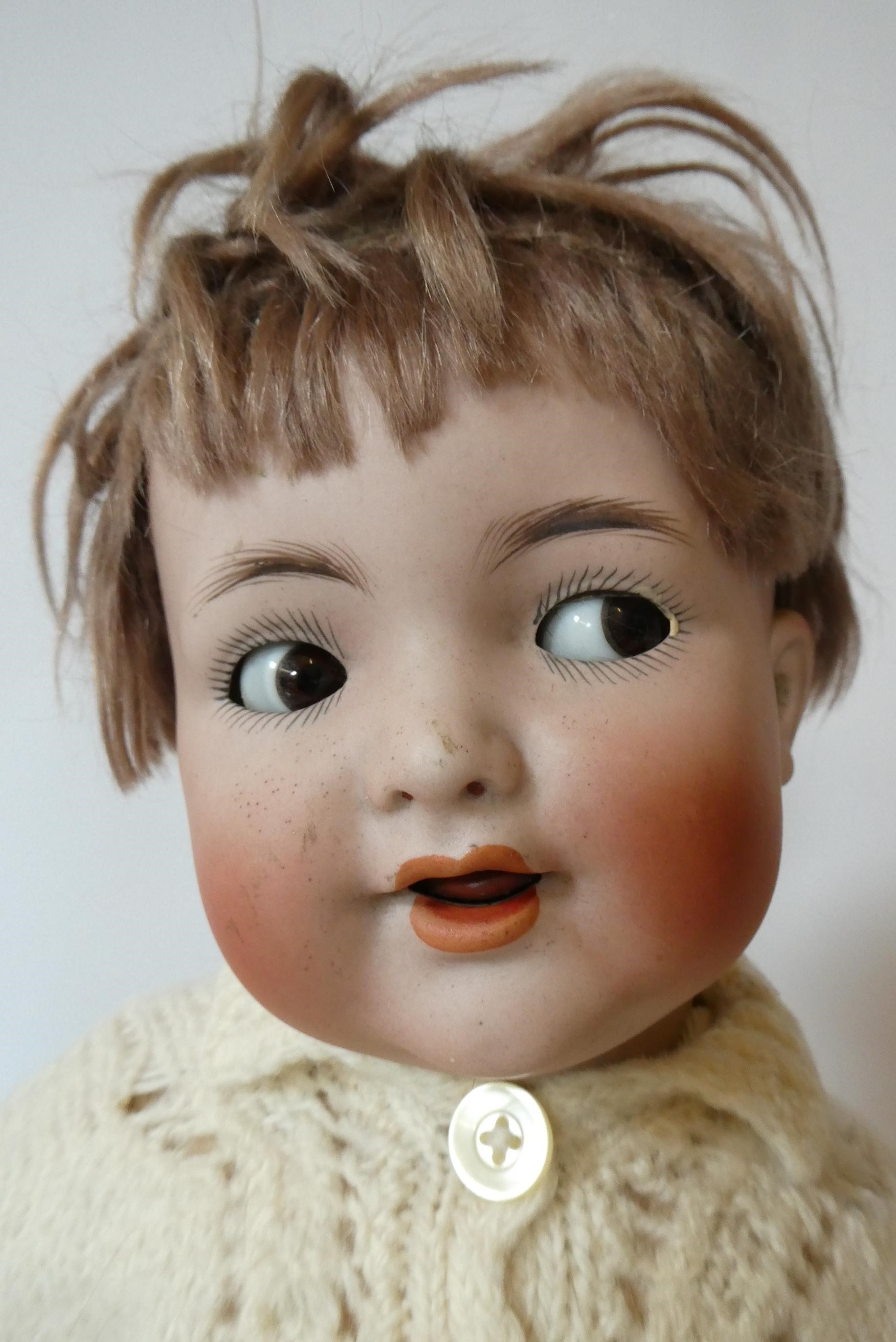 A Kammer & Reinhardt Halbig bisque socket head flirty doll Image