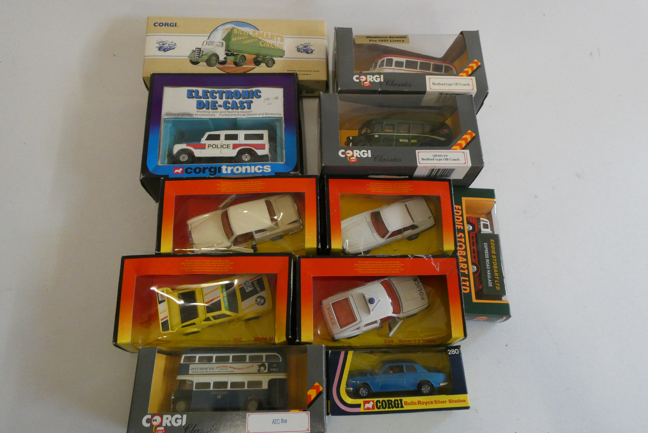 Eleven boxed late issues Corgi vehicles including Police Rover, Jaguar XJS, Rolls Royce and Billy Image