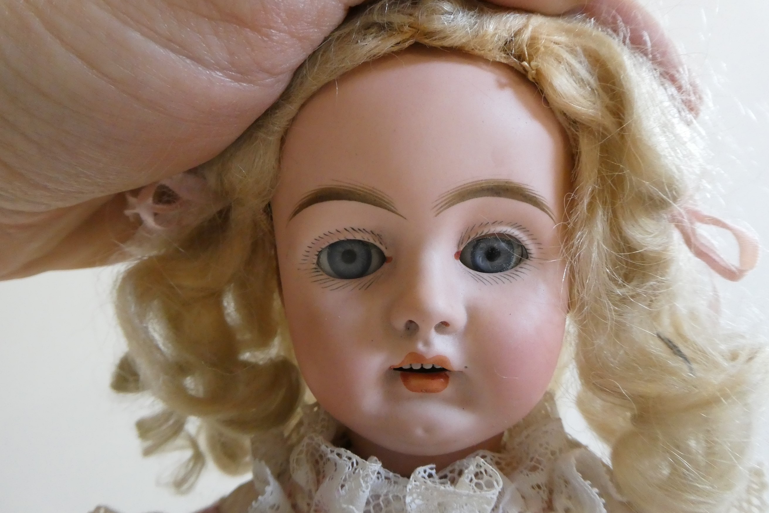 A Bahr & Proschild bisque socket head doll with blue glass sleeping eyes Image