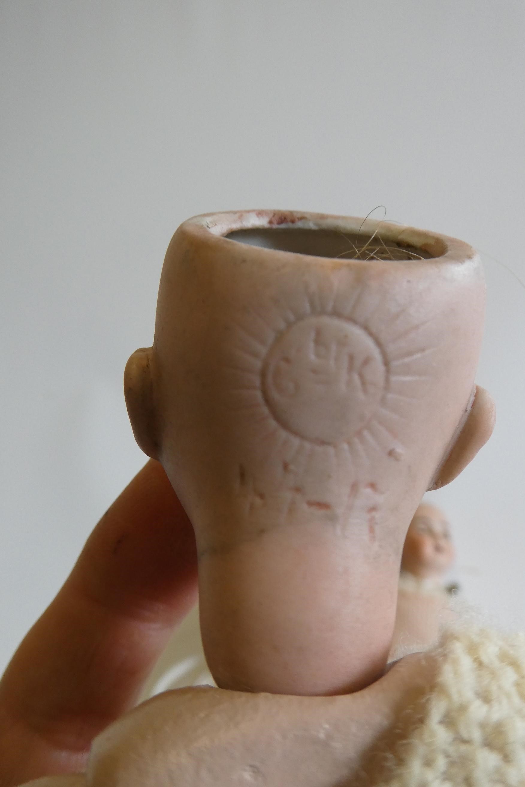 Three small bisque socket head dolls Image