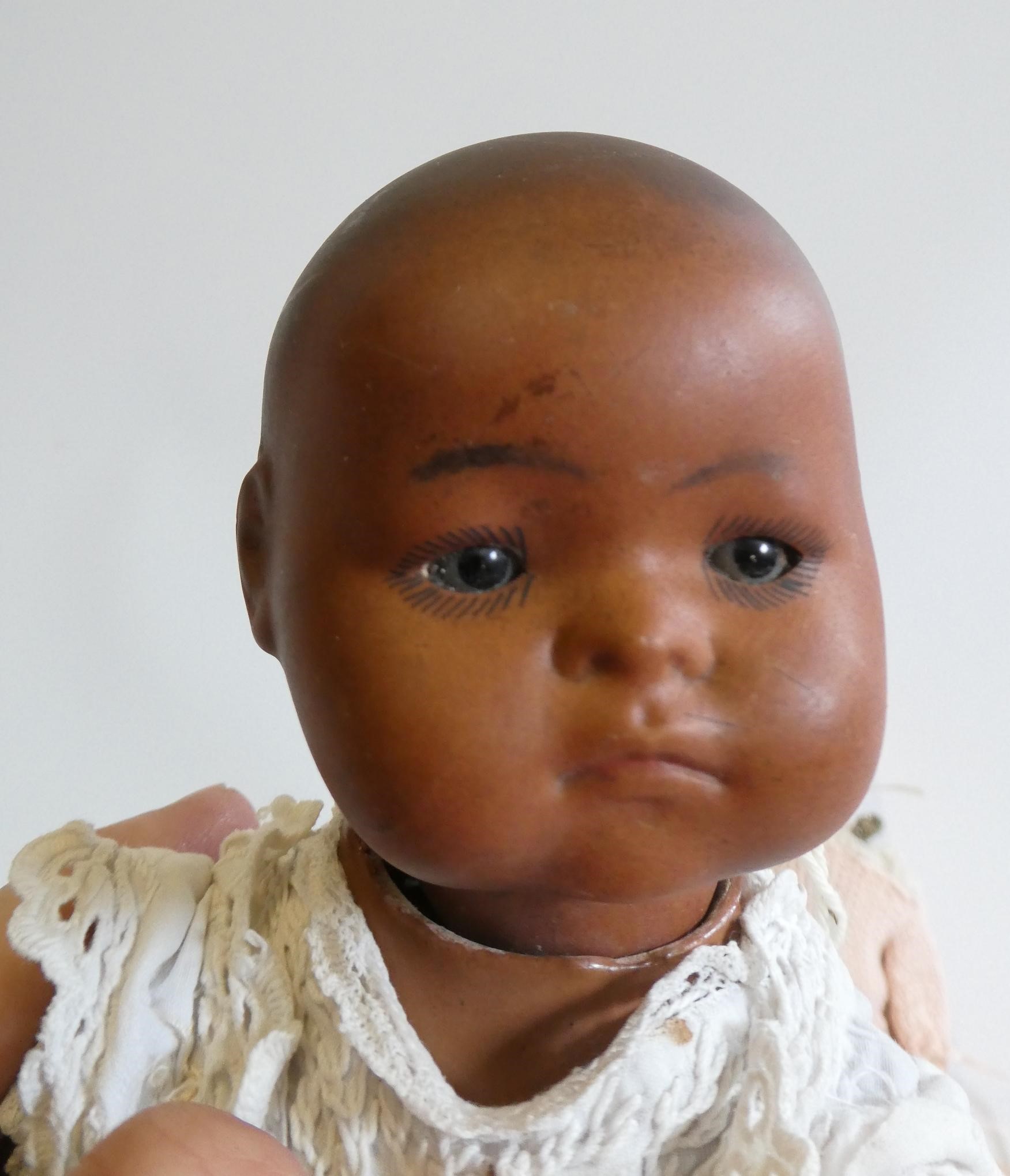 Three small bisque socket head dolls Image