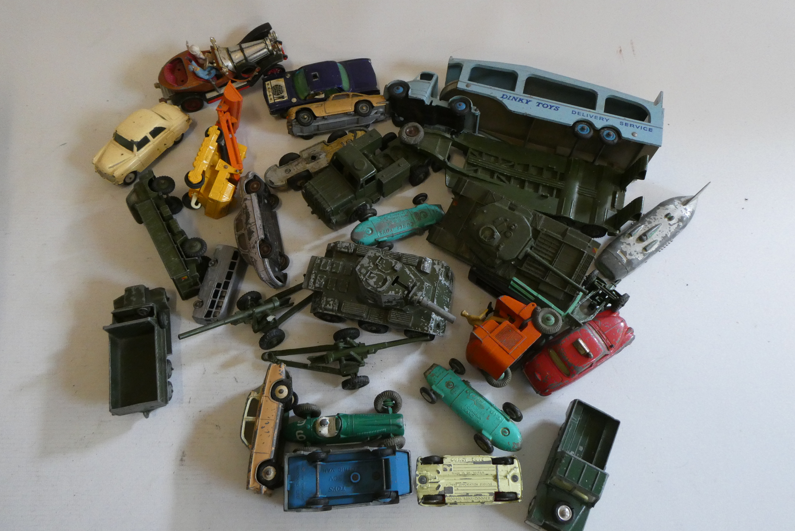 Playworn vehicles by Dinky and others including tank and car transporters, fair to poor (Est. plus Image