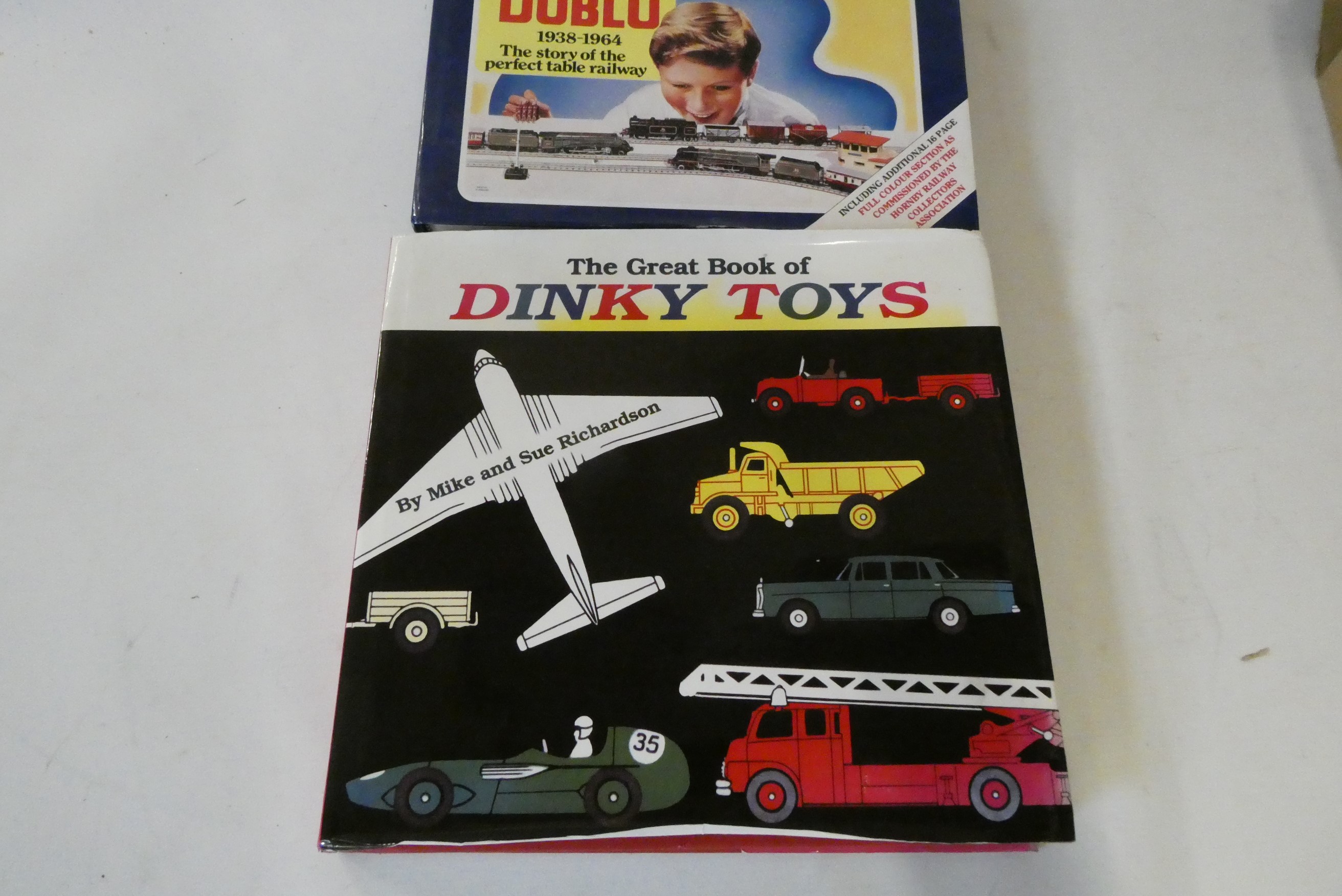 Unboxed playworn Dinky vehicles including trucks, saloon cars and tractor and The Great Book of Image