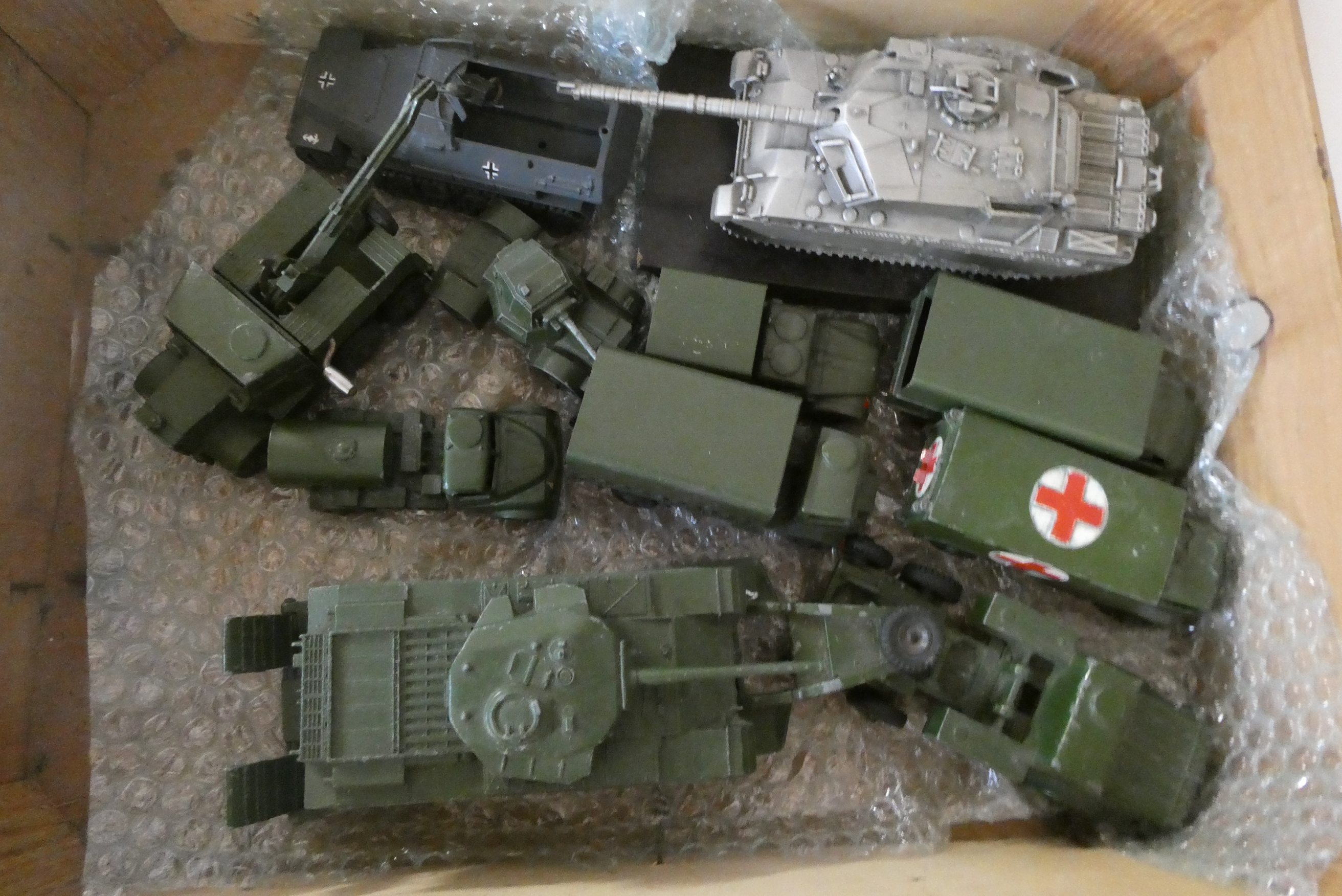 Unboxed military vehicles including tank transport with tank and army truck, tank model and German Image