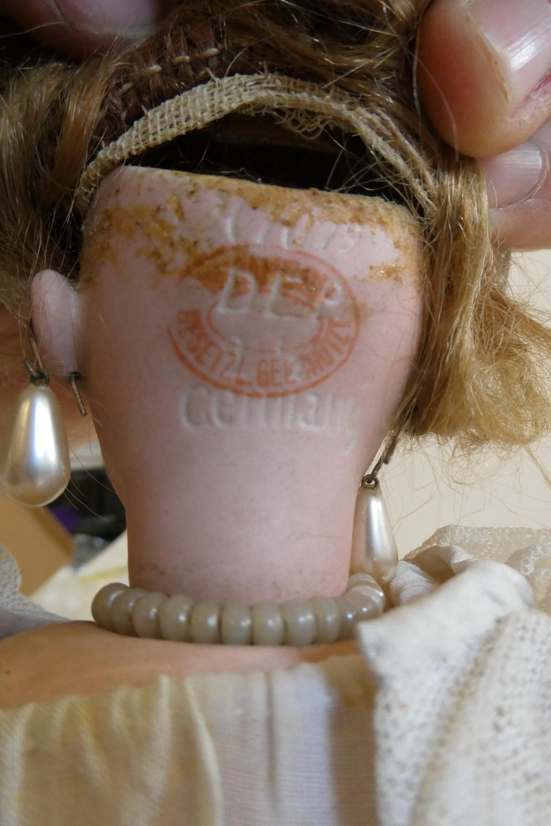 A Simon & Halbig socket head doll with blue glass sleeping eyes Image