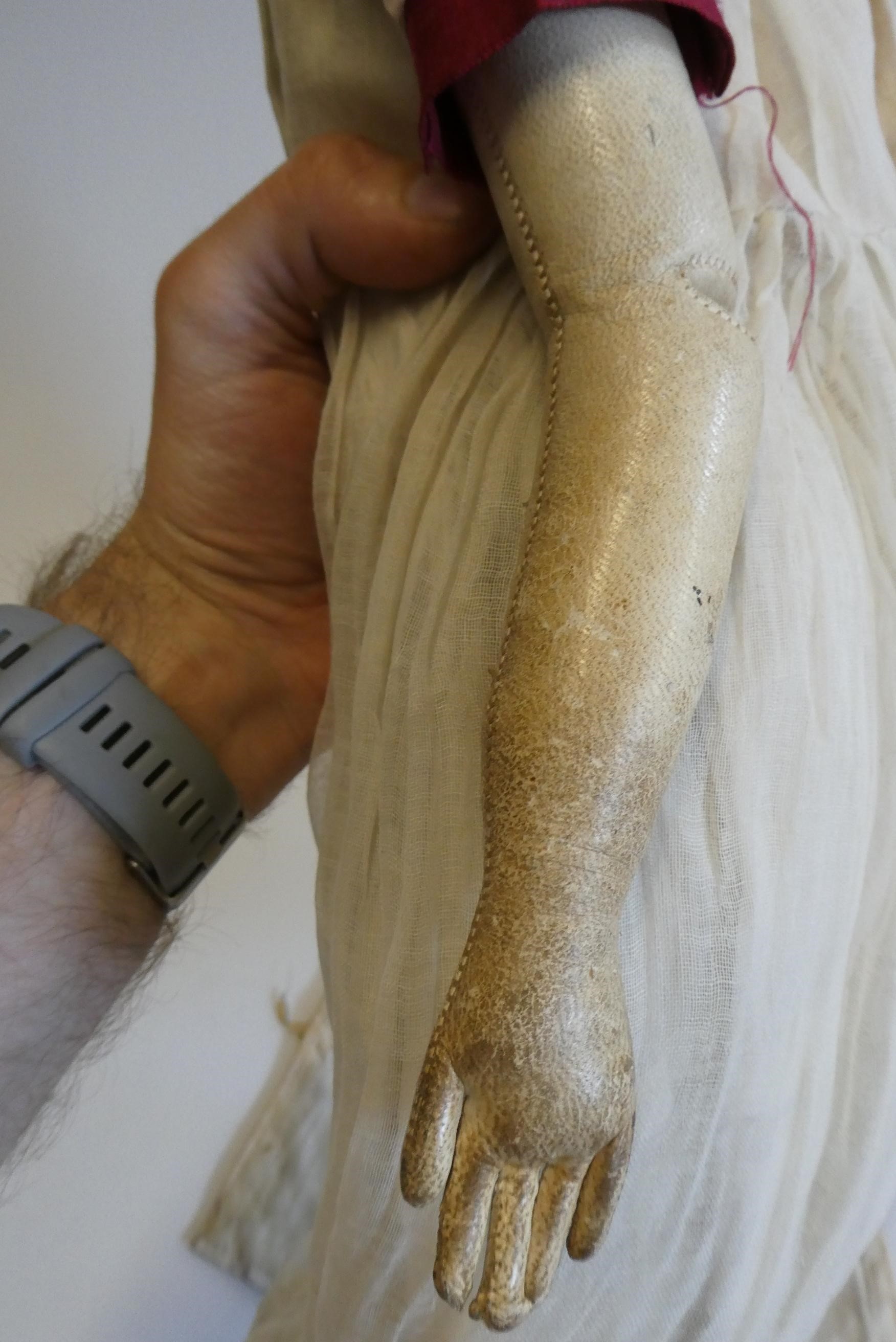 A Victorian china shoulder head doll with painted features, moulded hair, jointed kid body, lace Image