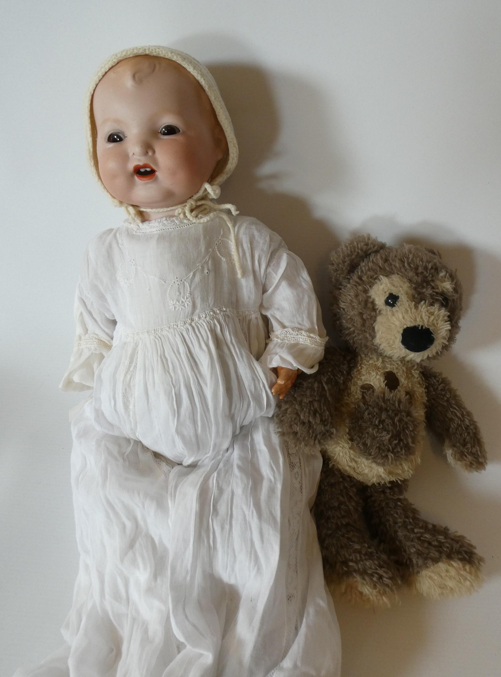 A Baby Gloria bisque flange neck "mamma" doll Image