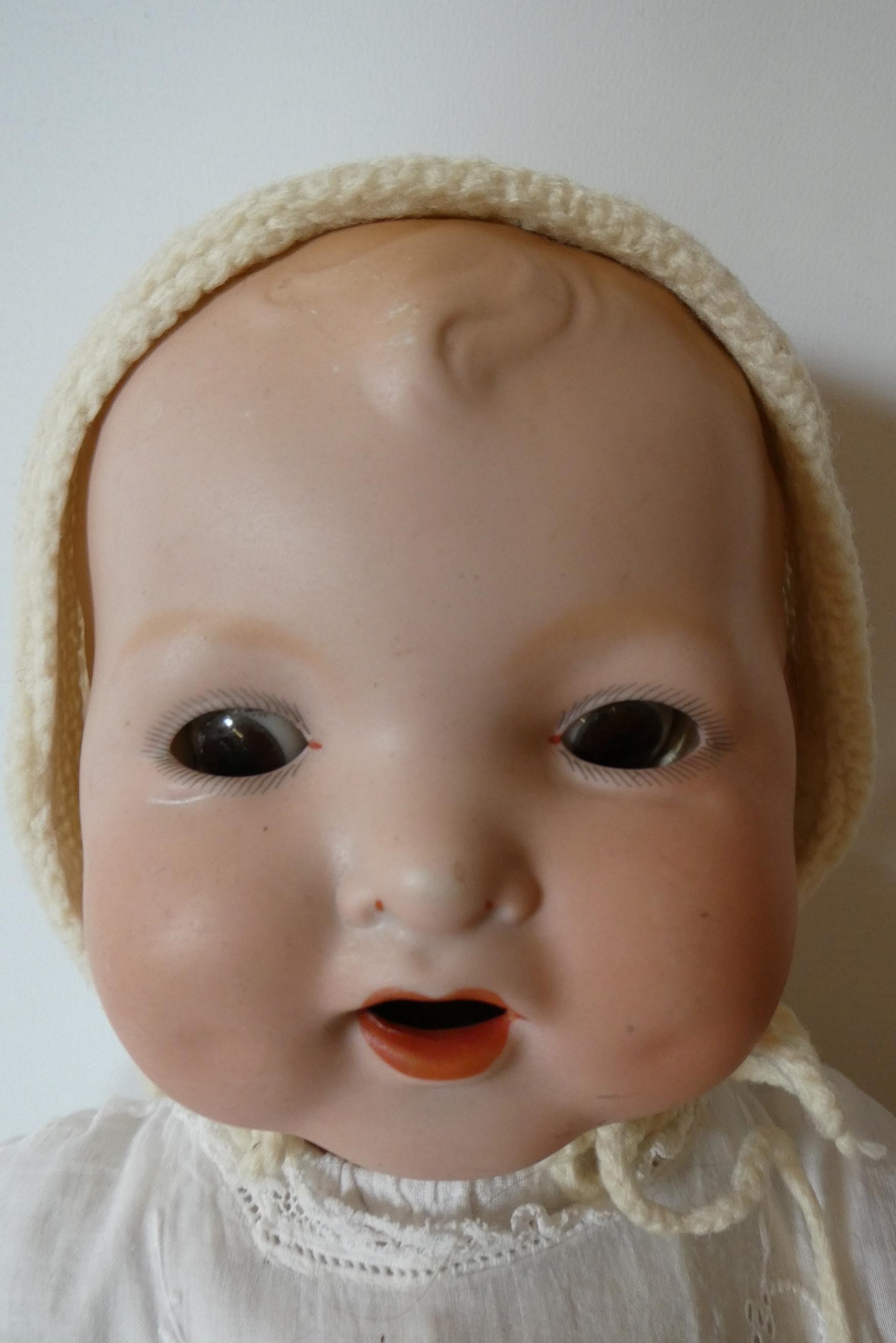 A Baby Gloria bisque flange neck "mamma" doll Image