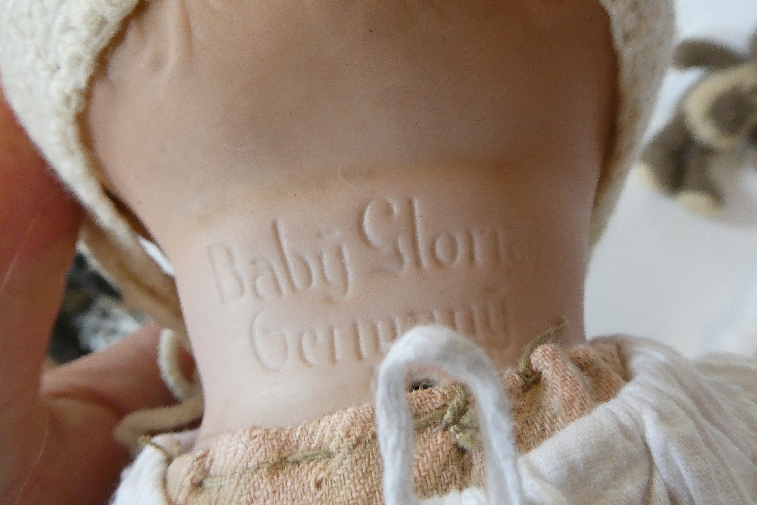 A Baby Gloria bisque flange neck "mamma" doll Image