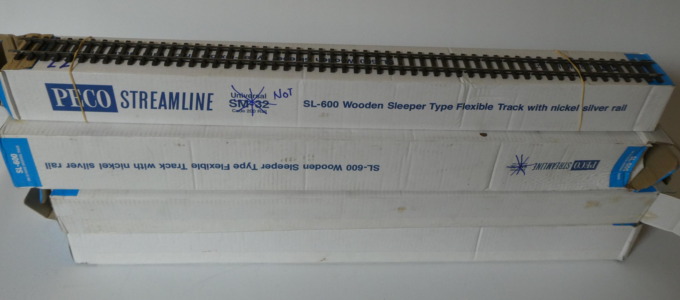 Sixty eight lengths of used PECO fine scale SL700 Gauge 0 flexible track. This track has been Image