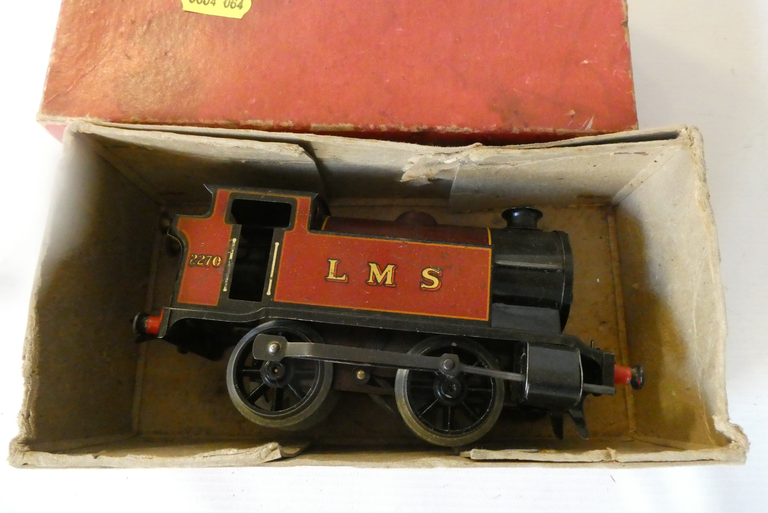 Hornby clockwork LMS passenger set with Type 501 locomotive, three coaches and track and a clockwork Image