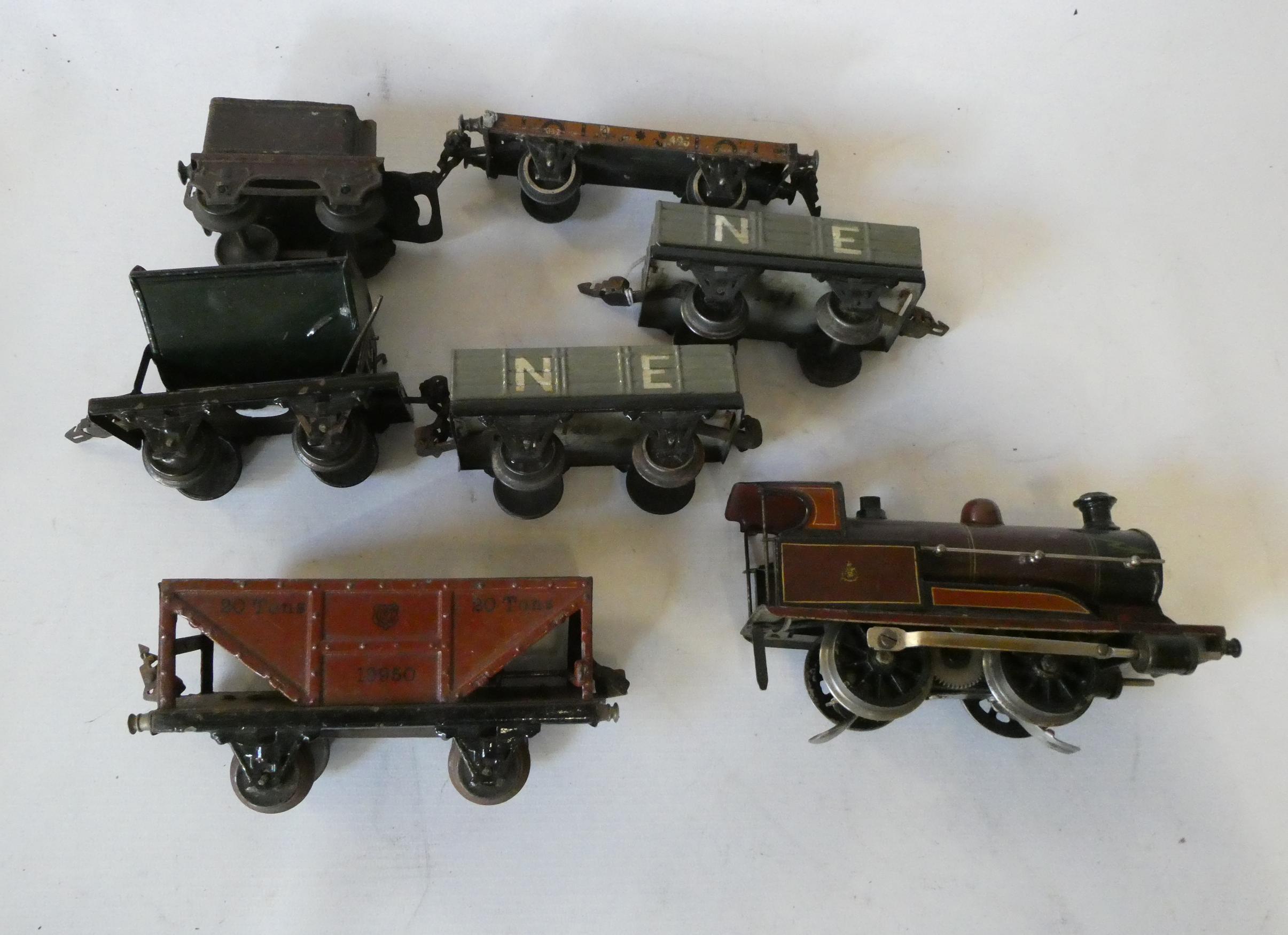 Marklin electric locomotives, tender missing, and five Marklin goods wagons, fair to poor (Est. plus Image