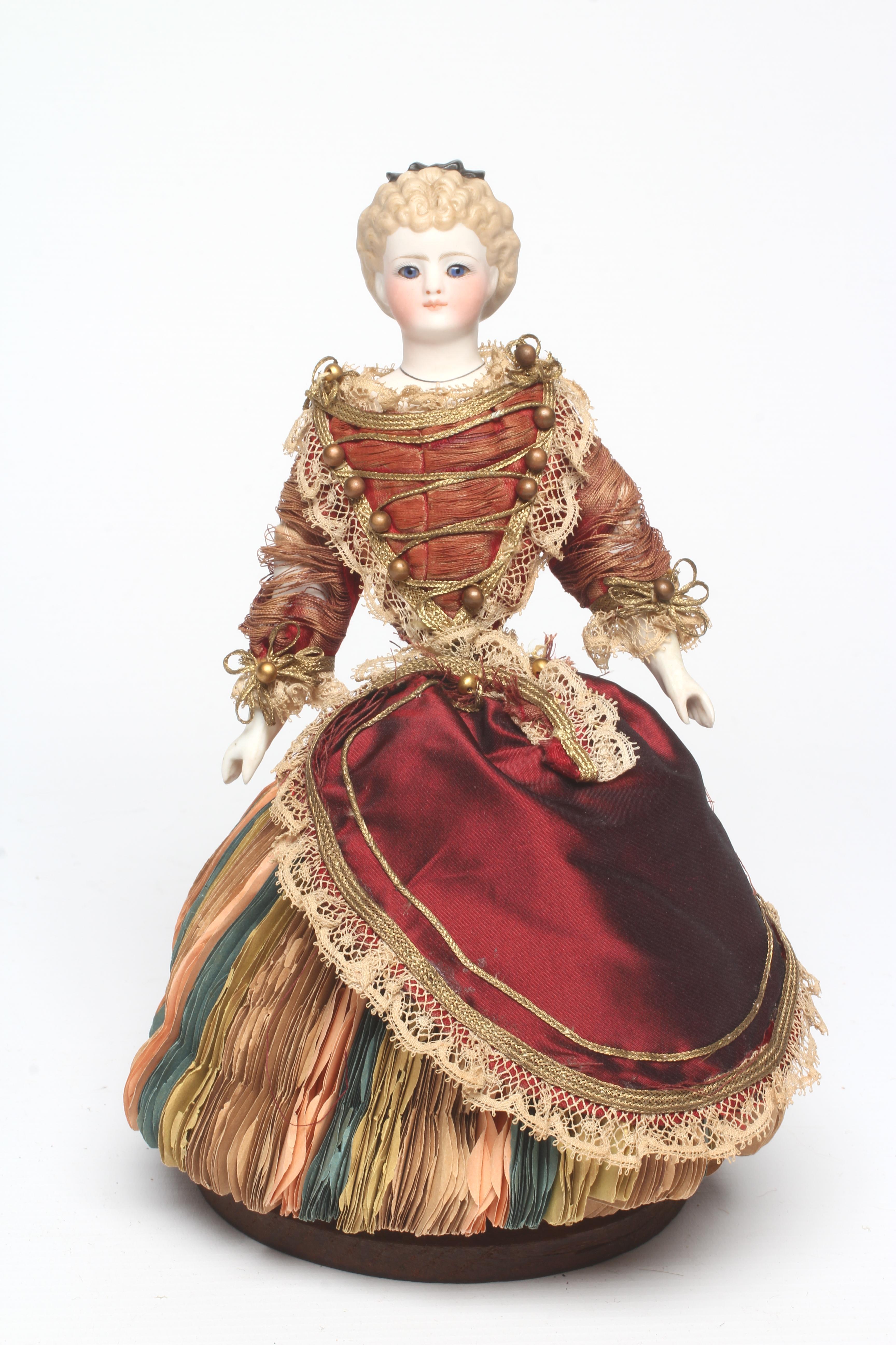 A rare late Victorian bisque shoulder head fortune doll with blue glass fixed eyes Image