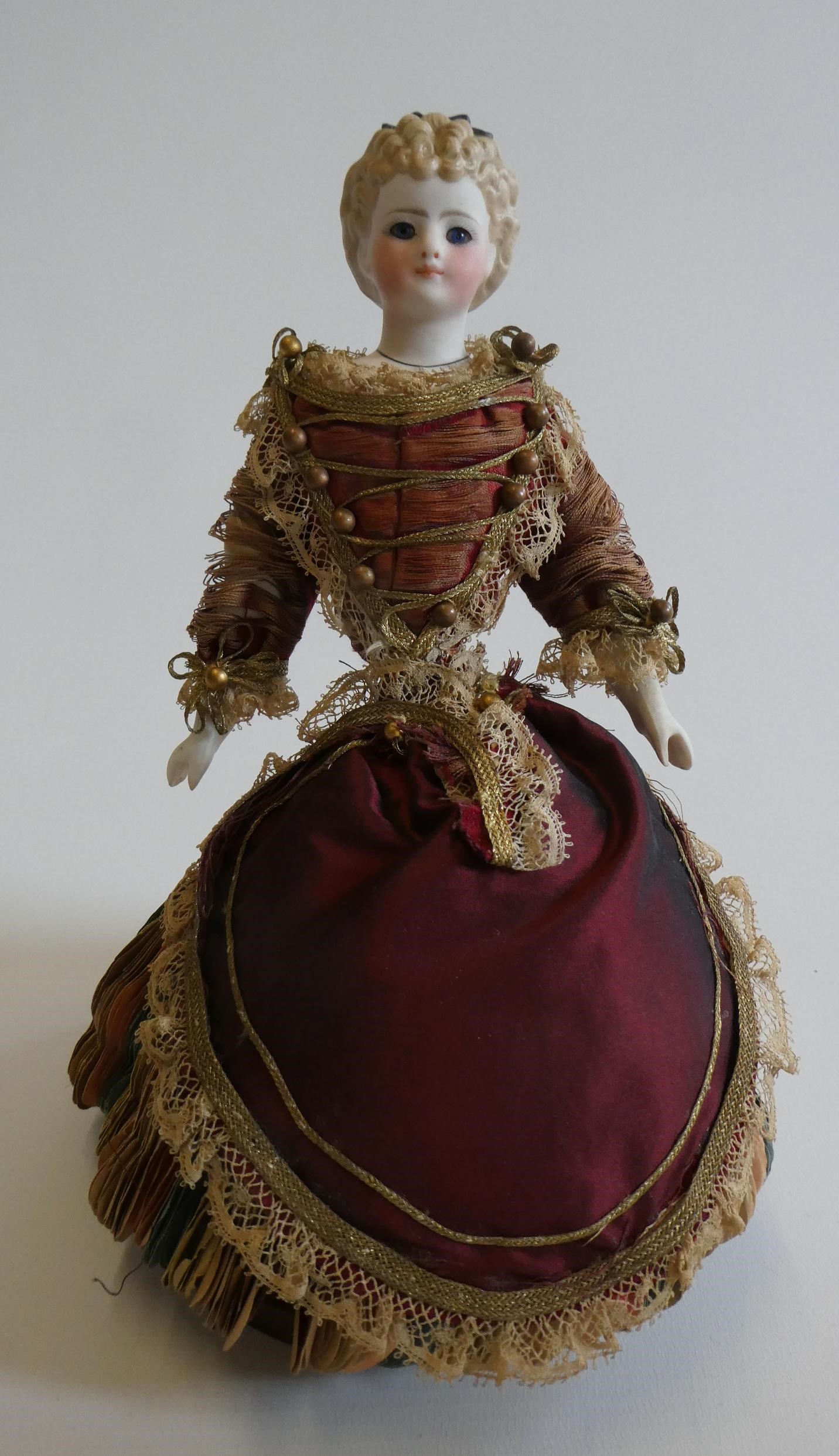 A rare late Victorian bisque shoulder head fortune doll with blue glass fixed eyes Image