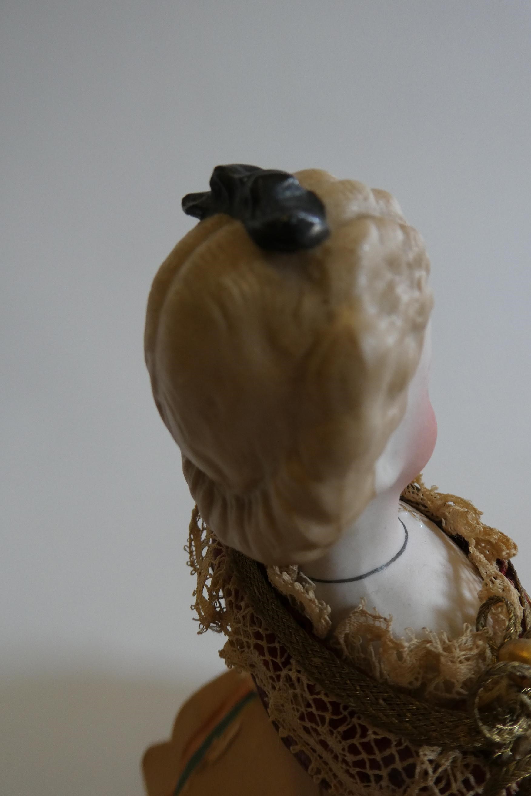 A rare late Victorian bisque shoulder head fortune doll with blue glass fixed eyes Image