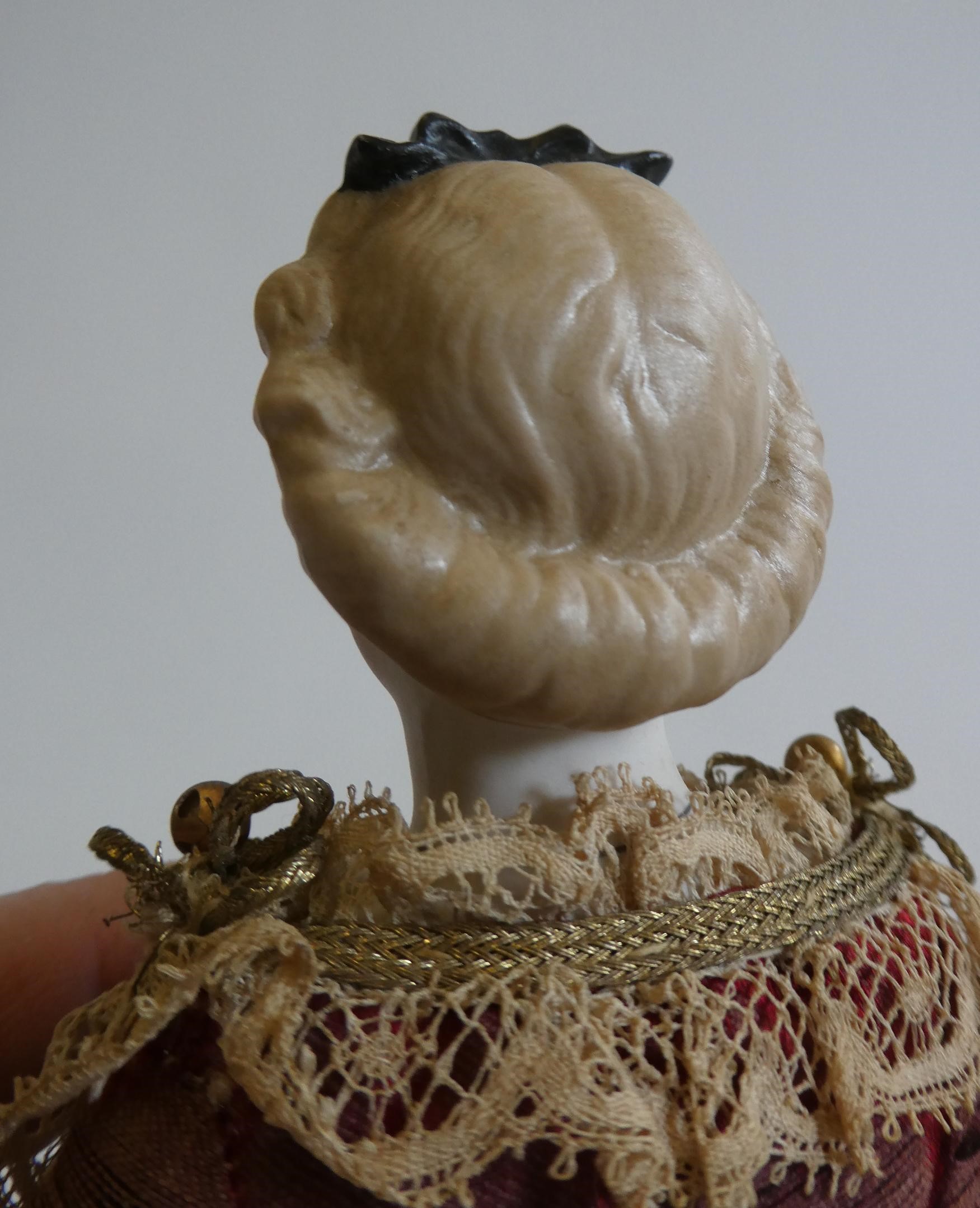 A rare late Victorian bisque shoulder head fortune doll with blue glass fixed eyes Image