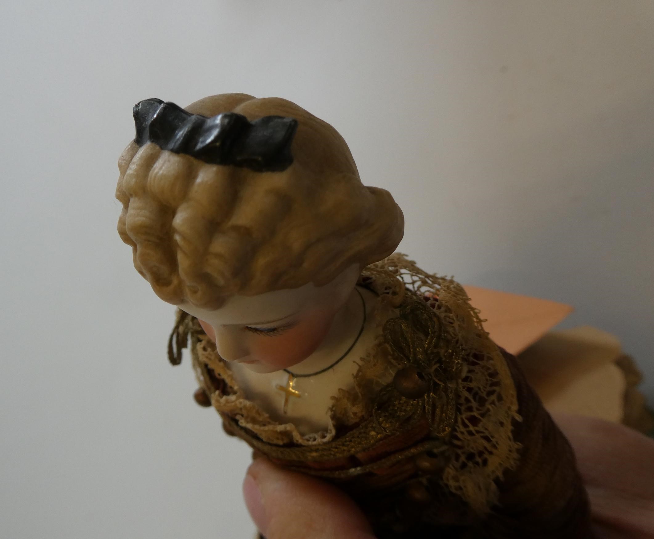 A rare late Victorian bisque shoulder head fortune doll with blue glass fixed eyes Image