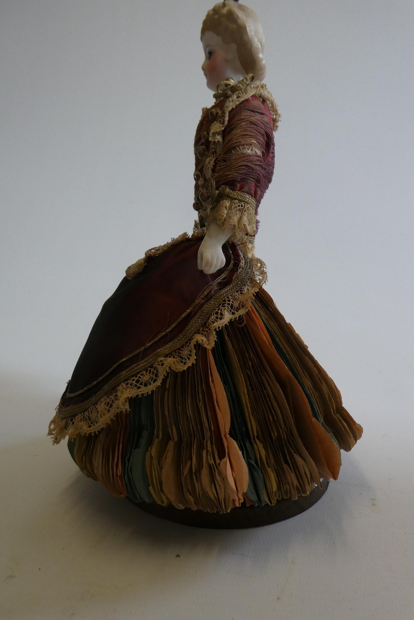 A rare late Victorian bisque shoulder head fortune doll with blue glass fixed eyes Image