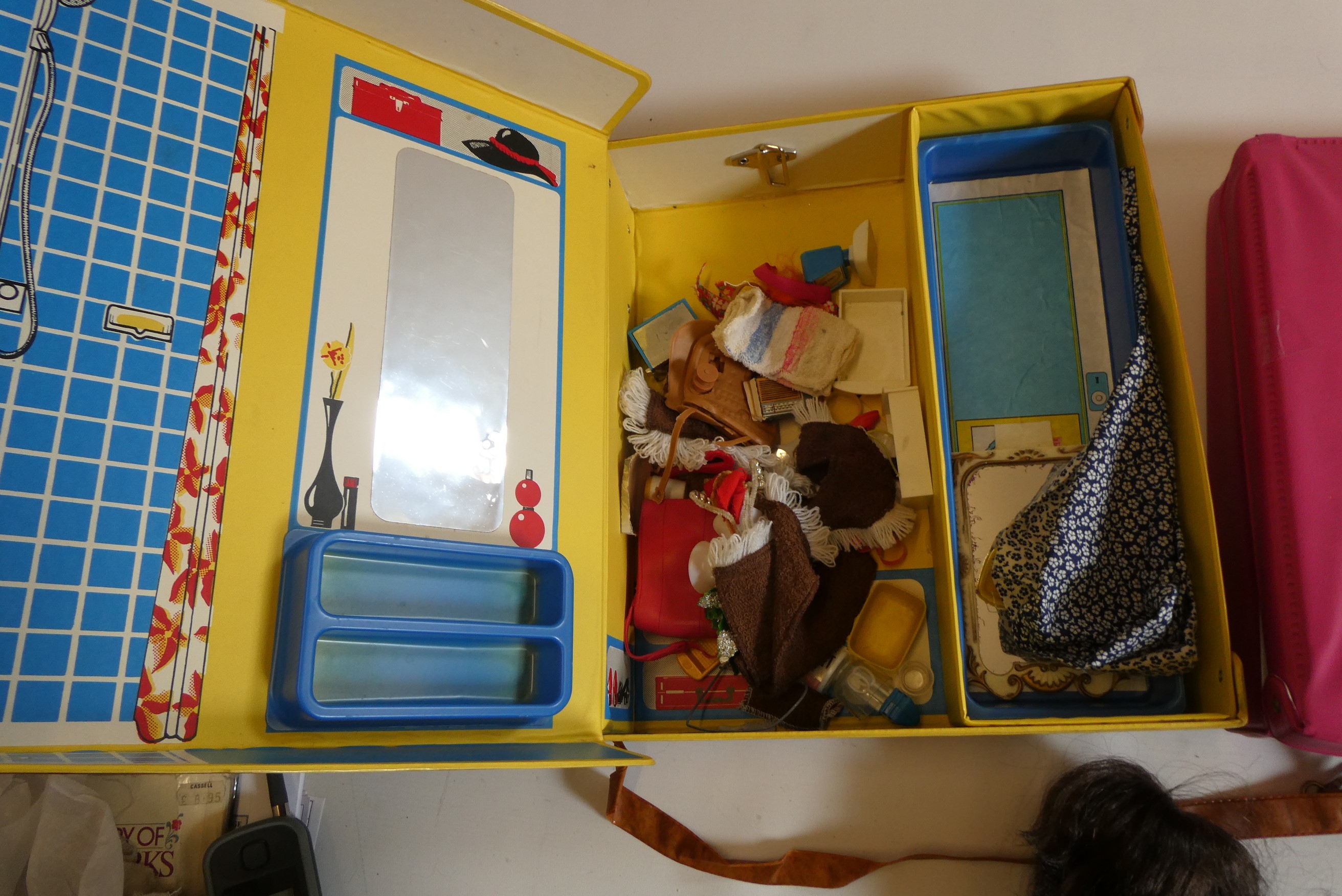 Seven Sindy dolls with two carrying cases and a quantity of clothing, together with another doll by Image