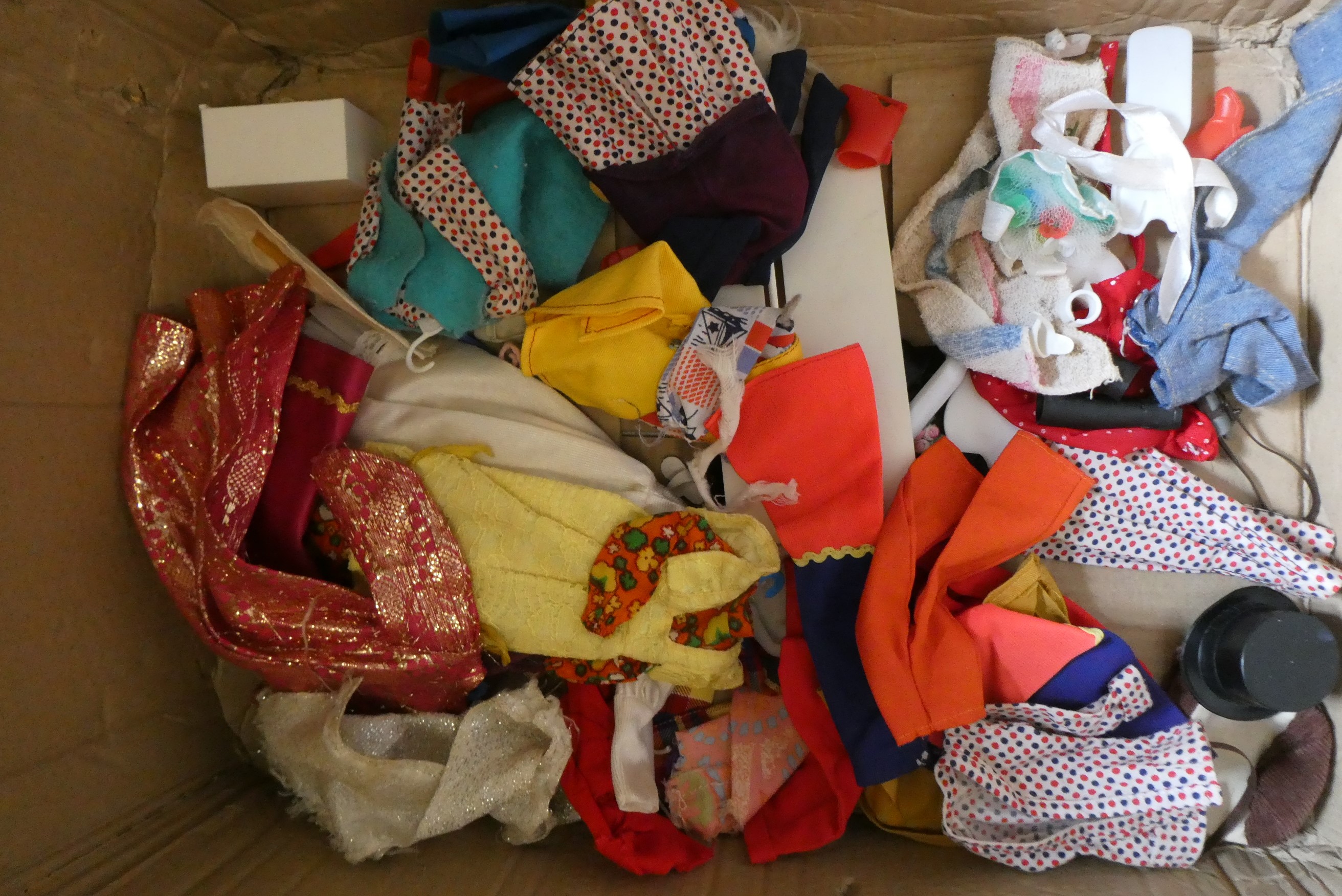 Seven Sindy dolls with two carrying cases and a quantity of clothing, together with another doll by Image