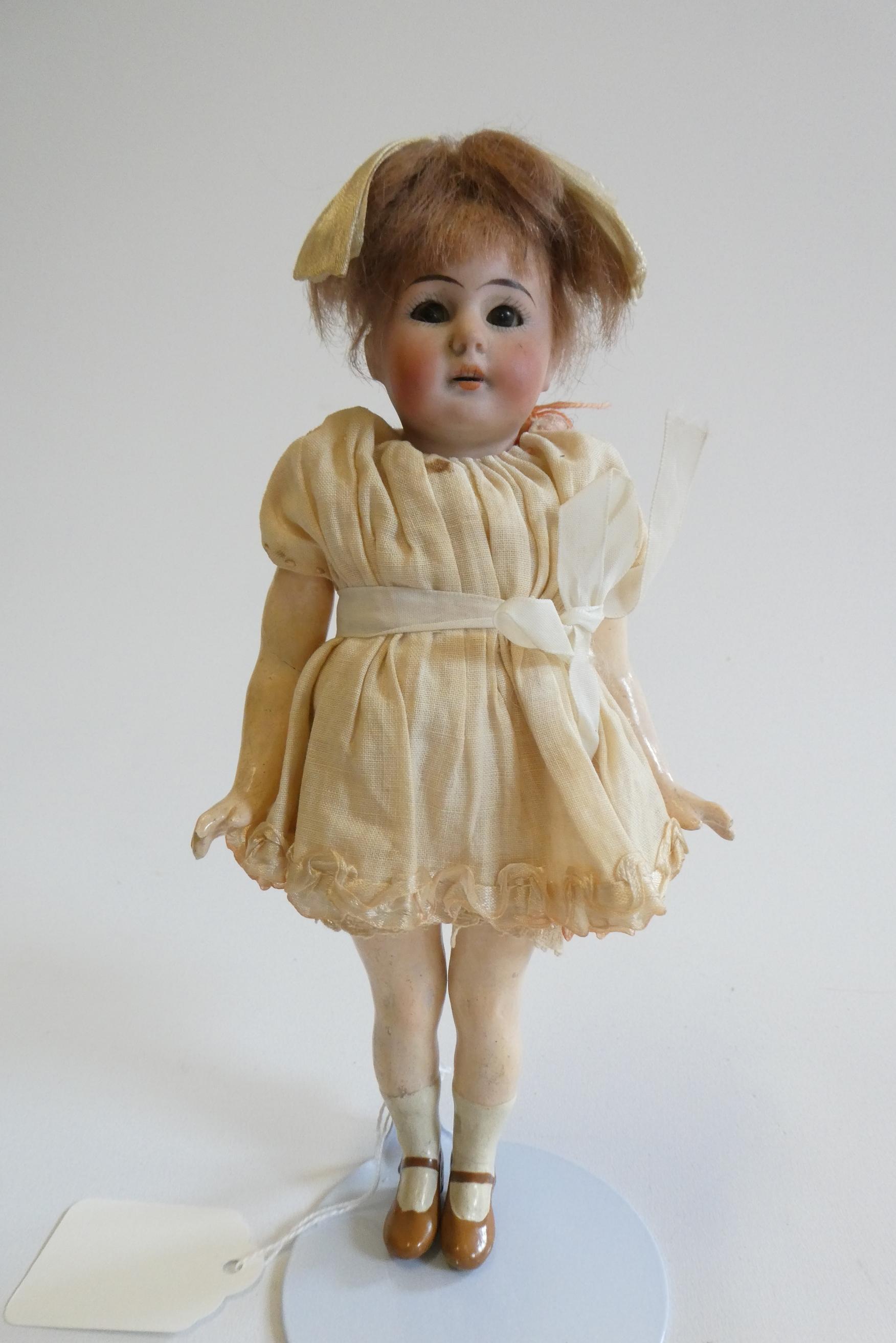 A Simon & Halbig bisque socket head doll Image