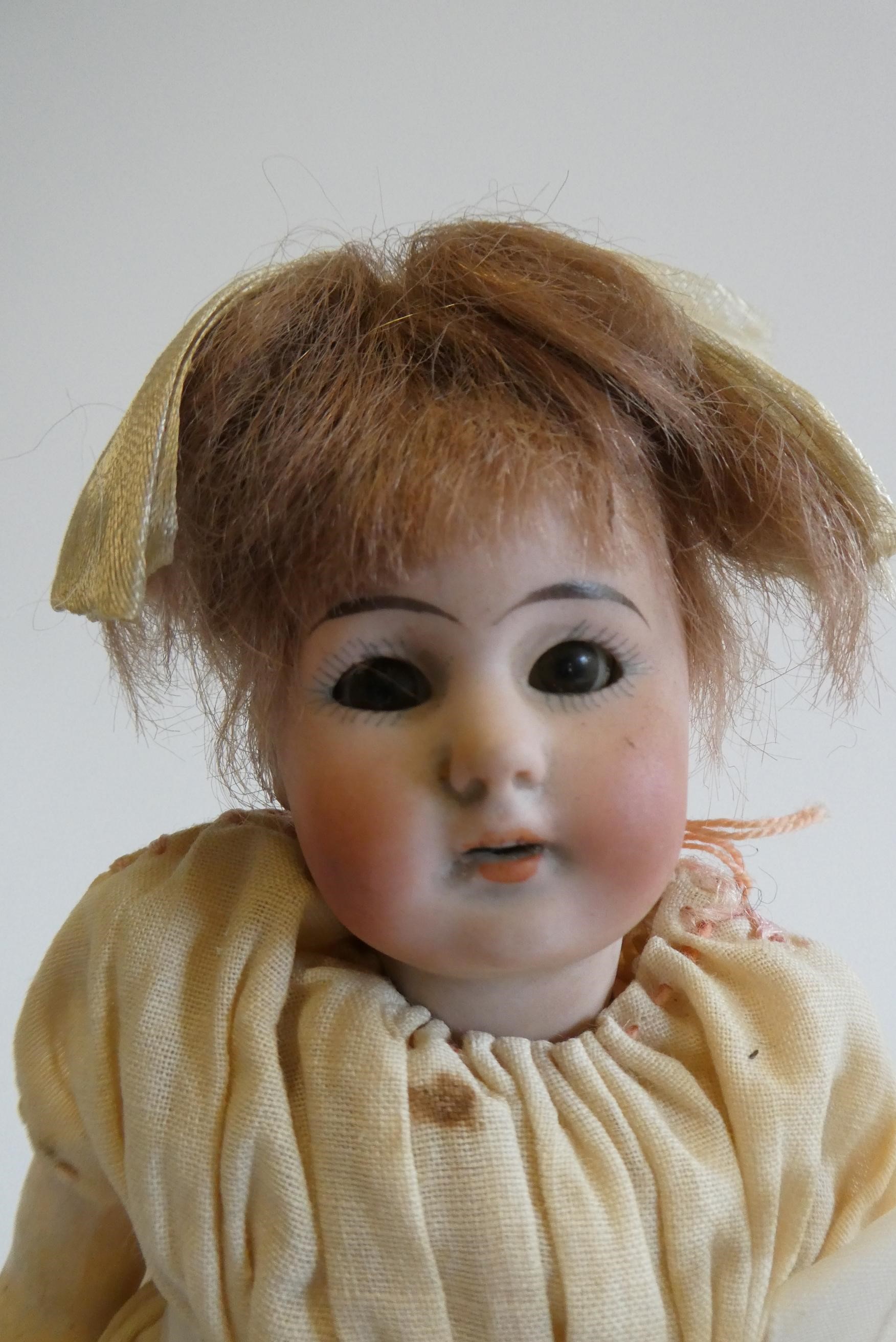 A Simon & Halbig bisque socket head doll Image