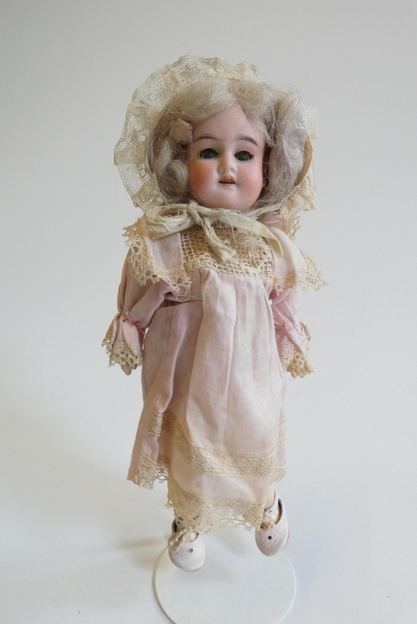 An Armand Marseille bisque socket head doll Image