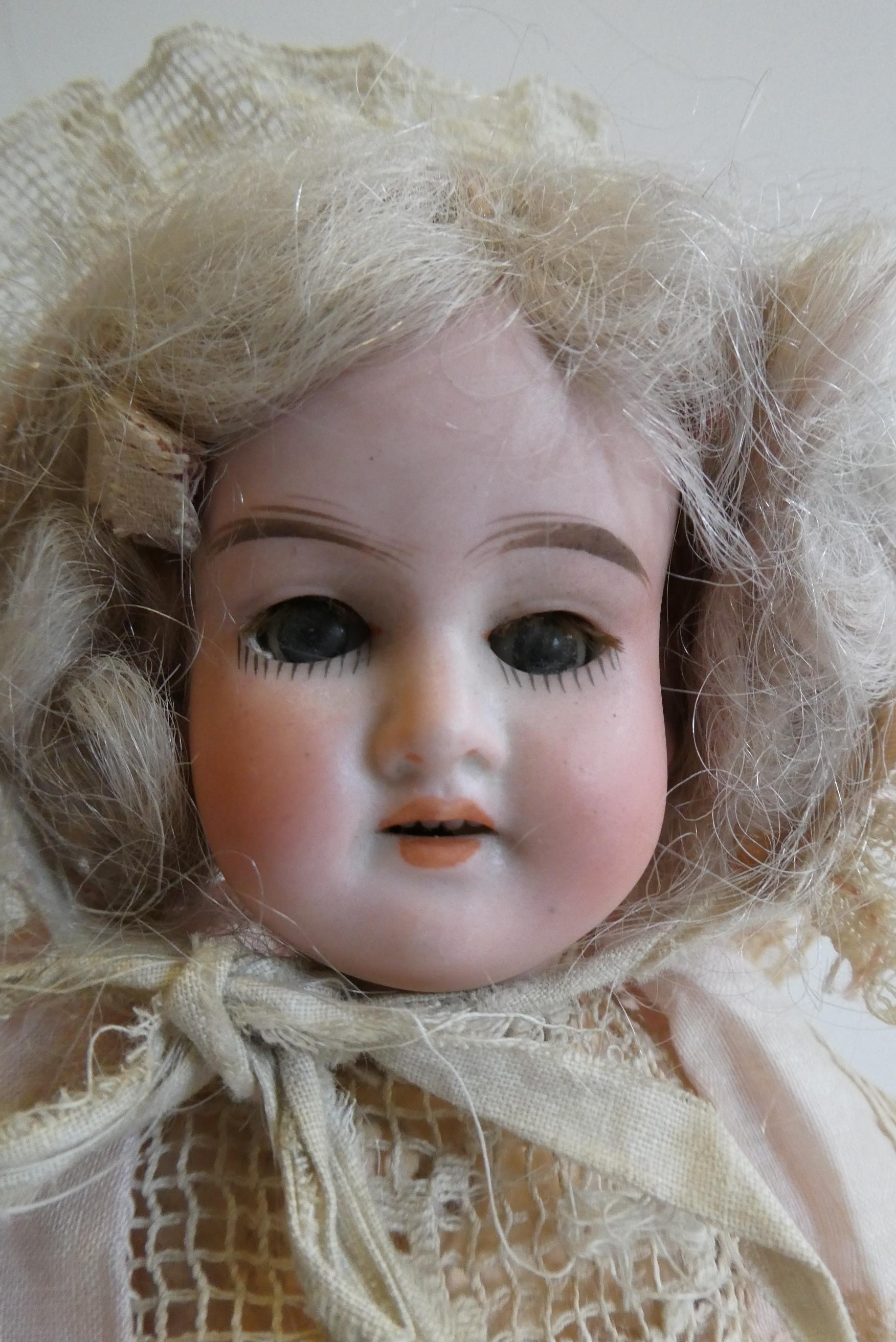 An Armand Marseille bisque socket head doll Image
