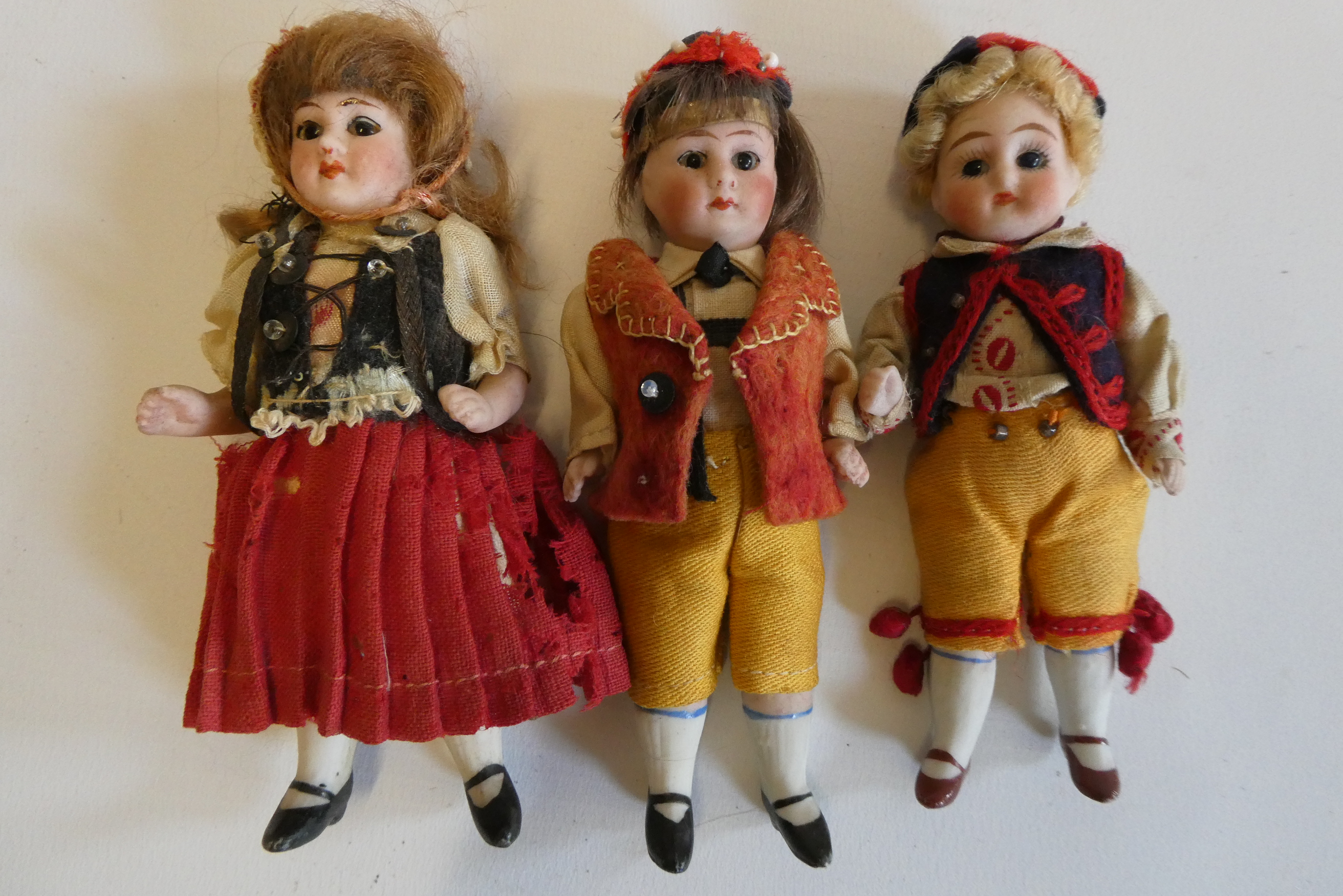 Three all bisque doll's house dolls Image
