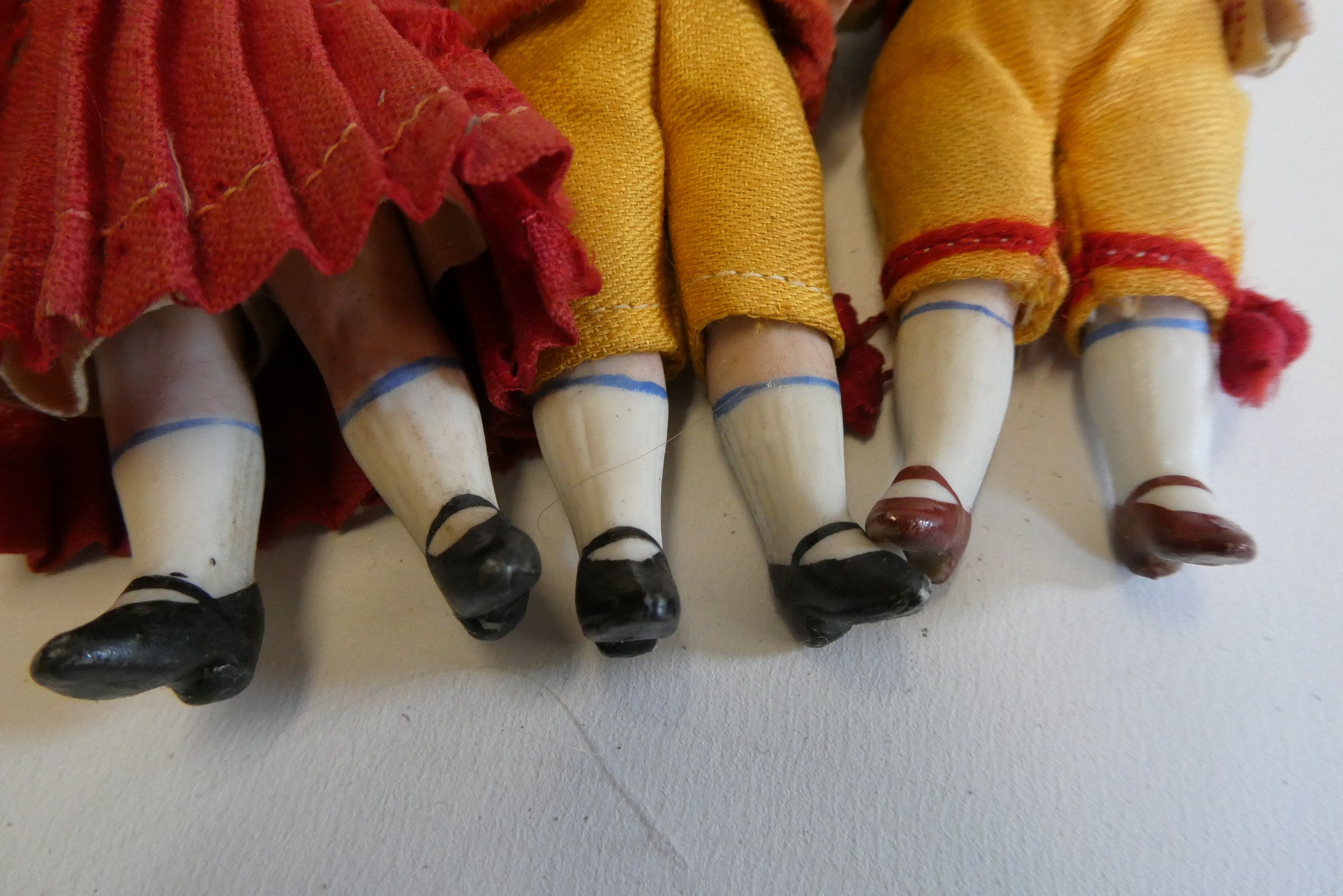 Three all bisque doll's house dolls Image