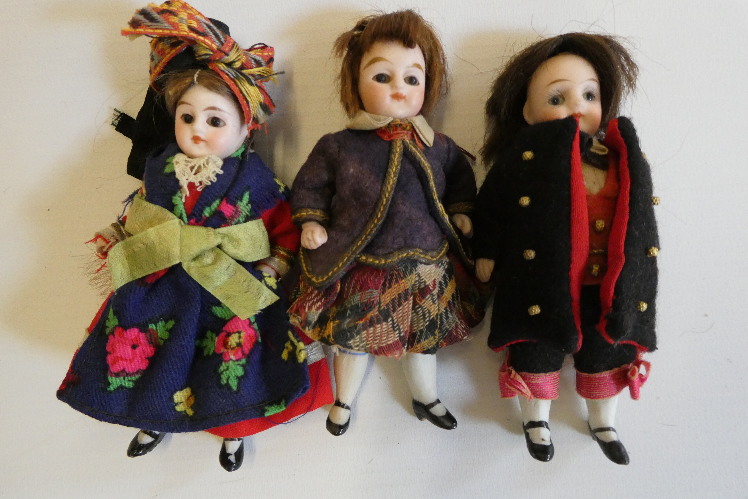 Three all bisque doll's house dolls Image