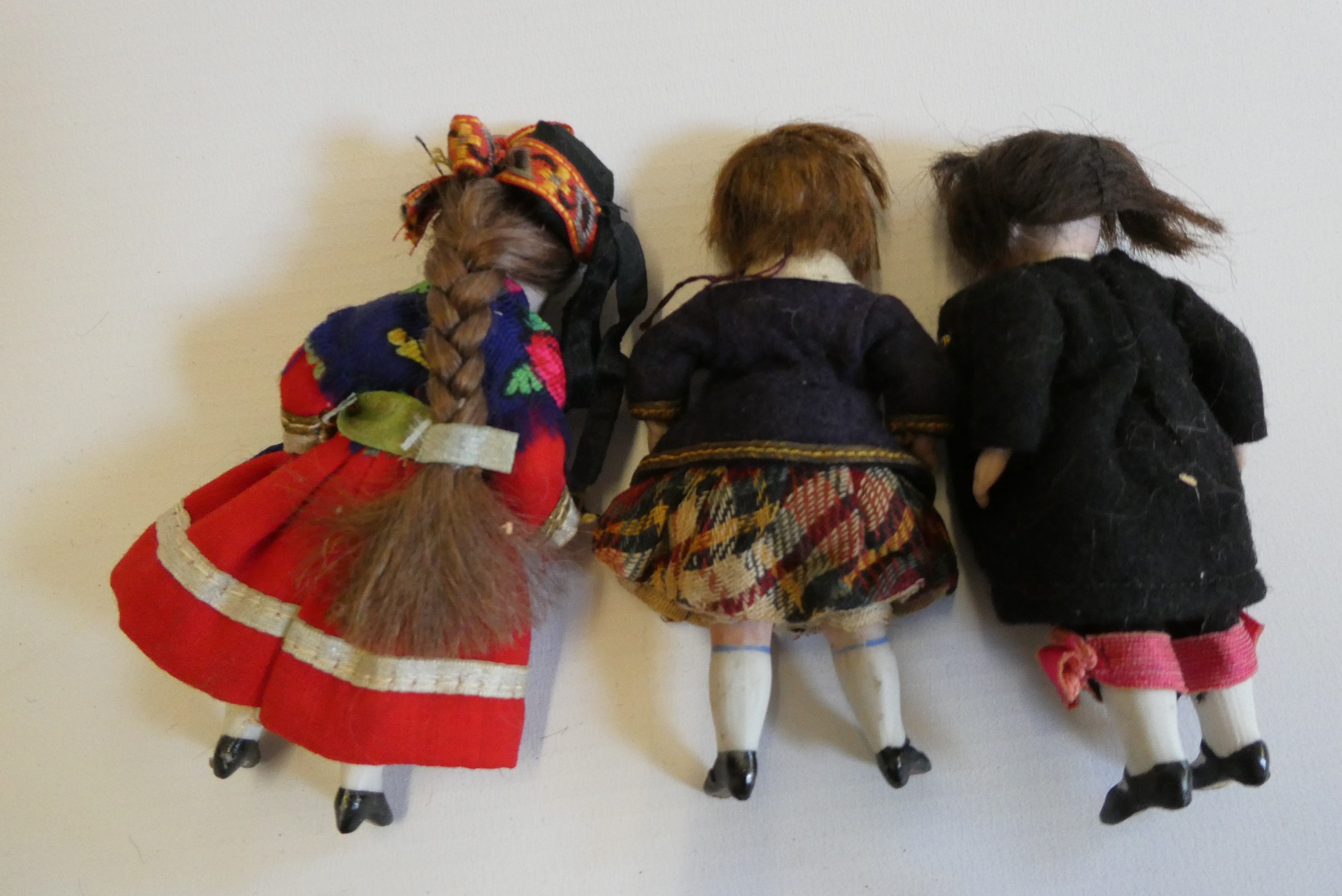 Three all bisque doll's house dolls Image