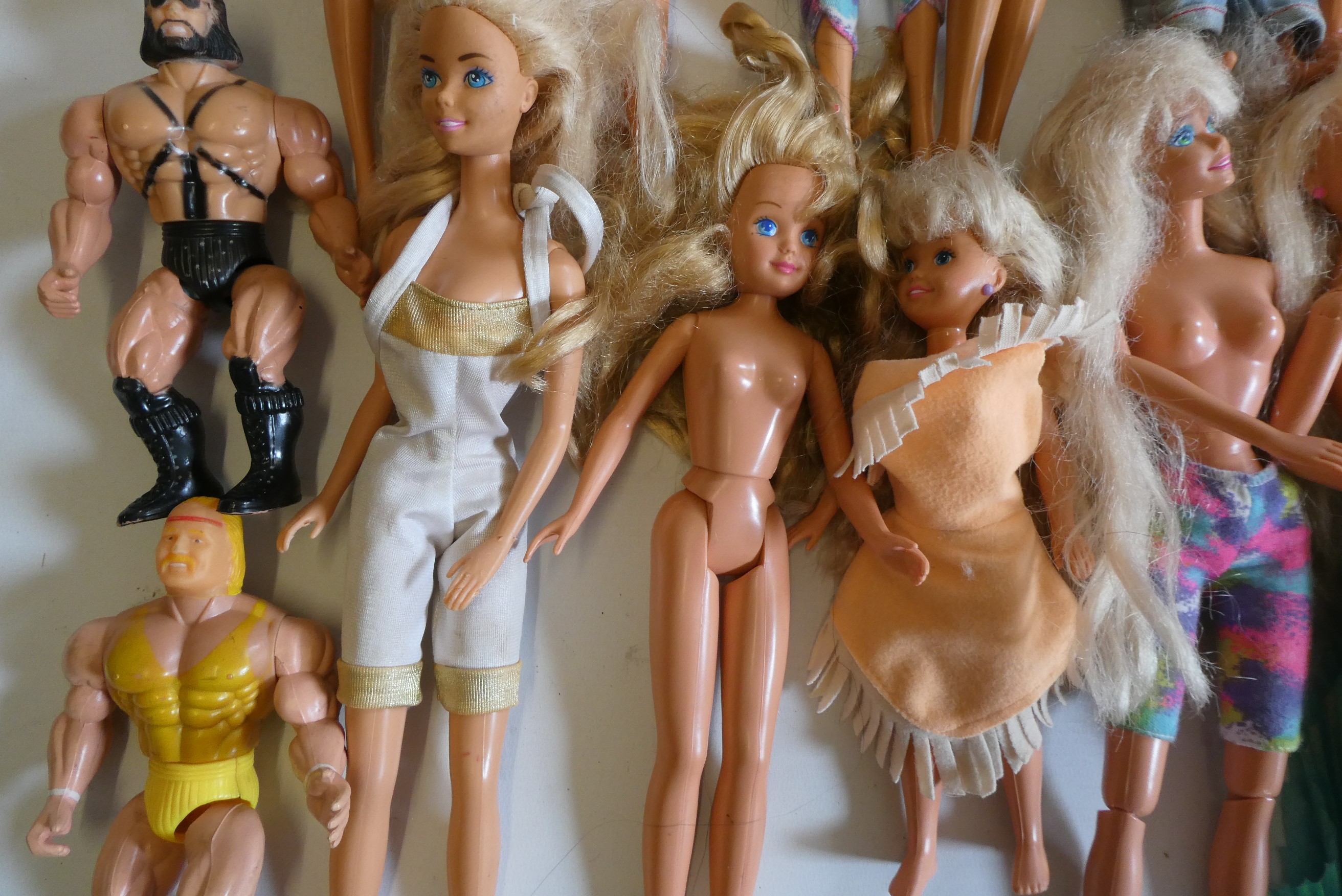 Six Barbie dolls with two Ken dolls, two sisters, nine other dolls, three unassociated horses and Image